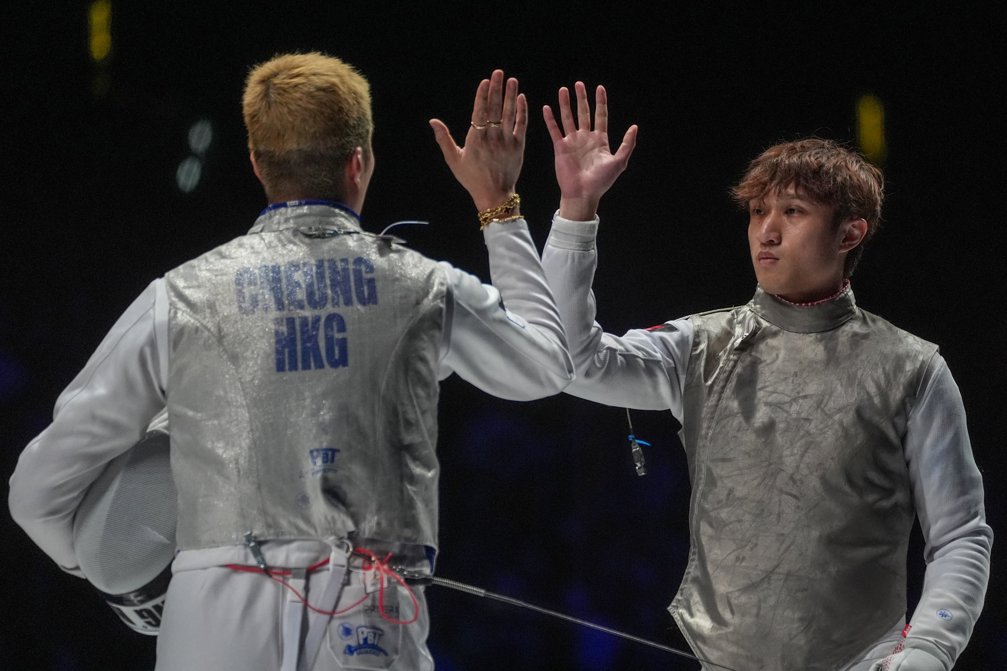 Hong Kong’s Ryan Choi (right), high-fiving team-mate Cheung Ka-long during the World Championships men’s foil team final against Italy in July, has been “reflecting on my fencing”. Photo: Elson Li