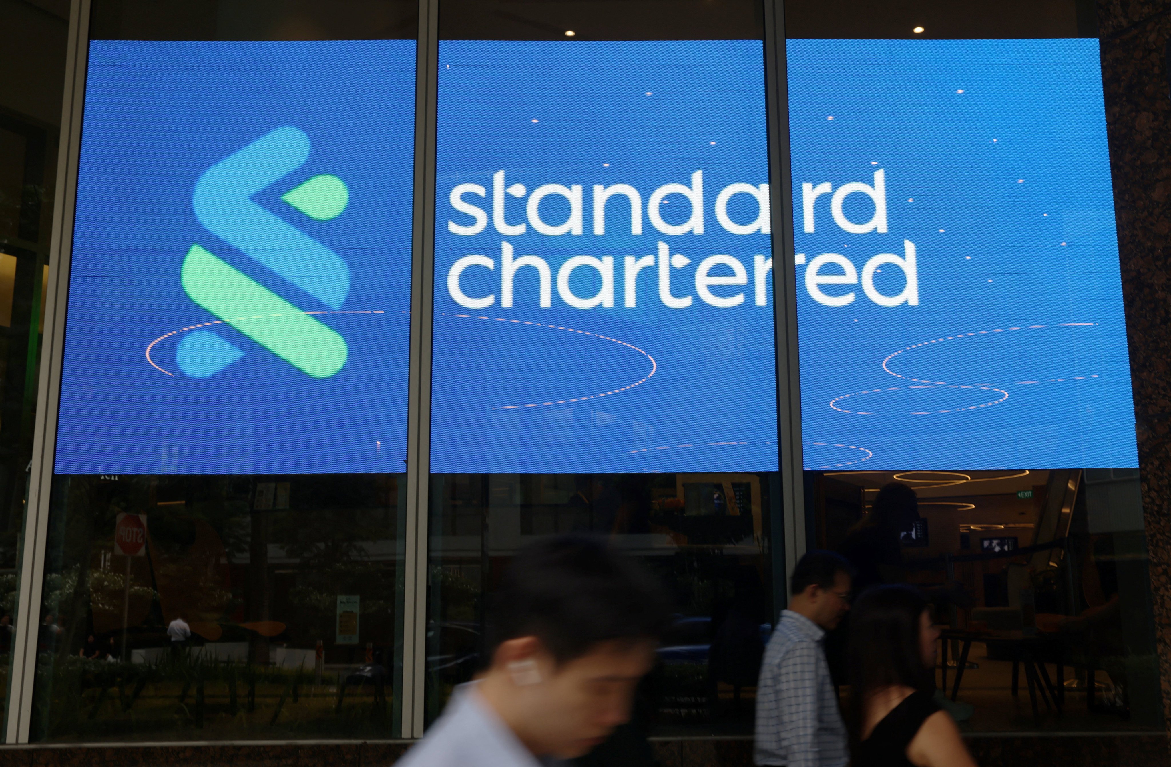 Standard Chartered’s logo on a building in Singapore. Photo: Reuters
