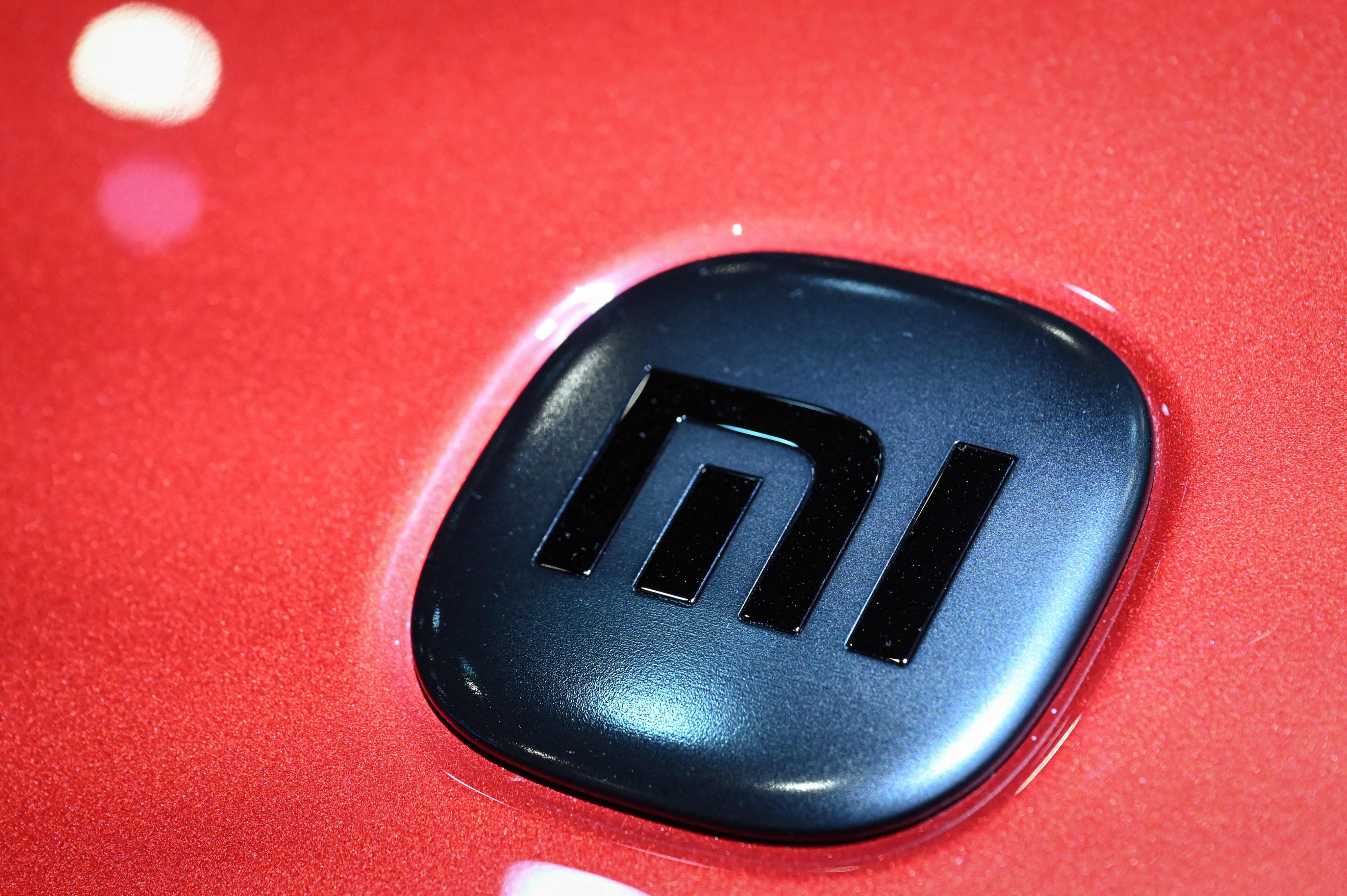 Xiaomi’s logo on an SU7 electric car at the Beijing Auto Show in April. Photo: AFP