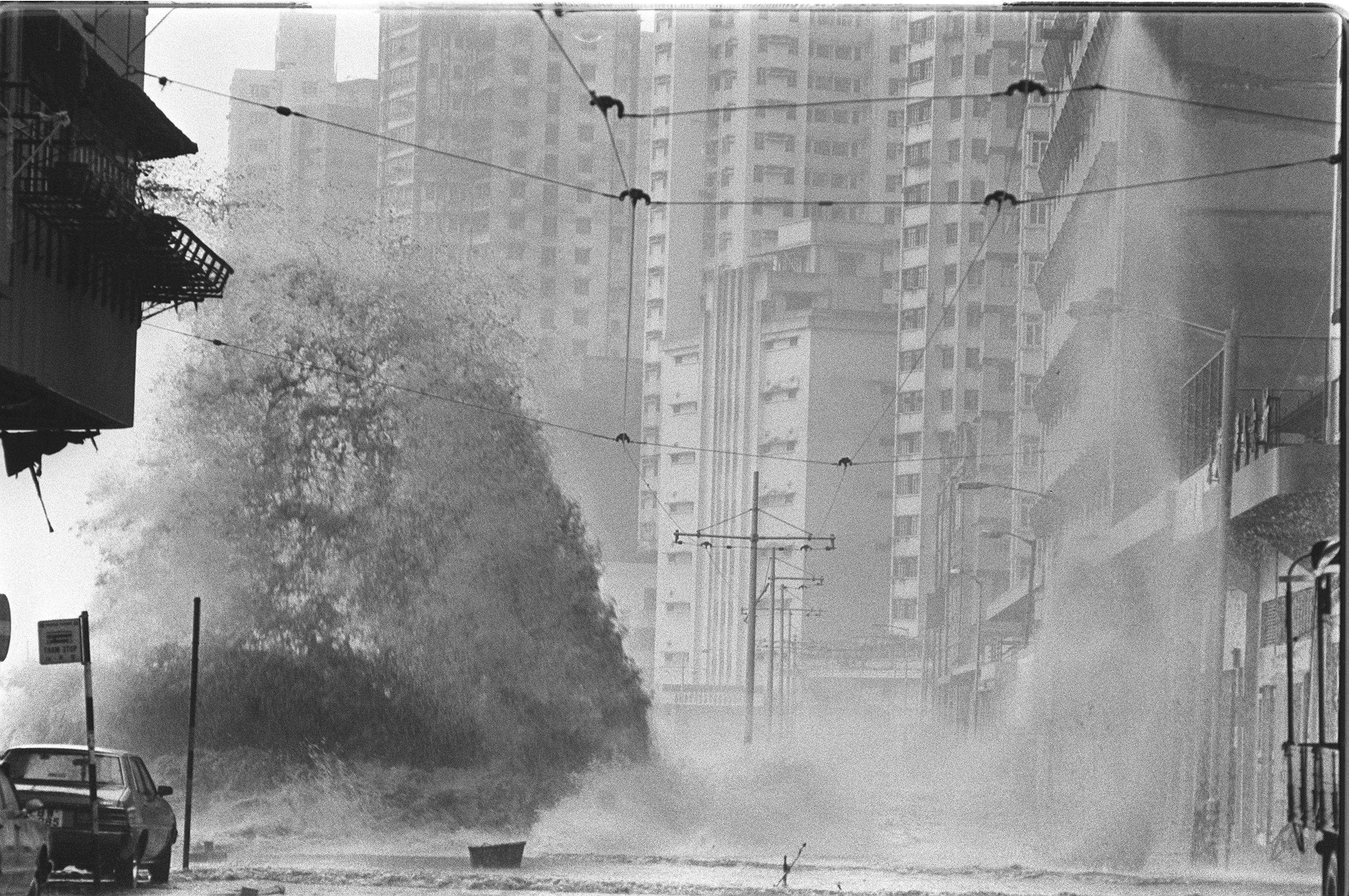 A huge wave hits the Kennedy Town waterfront as a typhoon approaches Hong Kong in 1983. Photo: SCMP