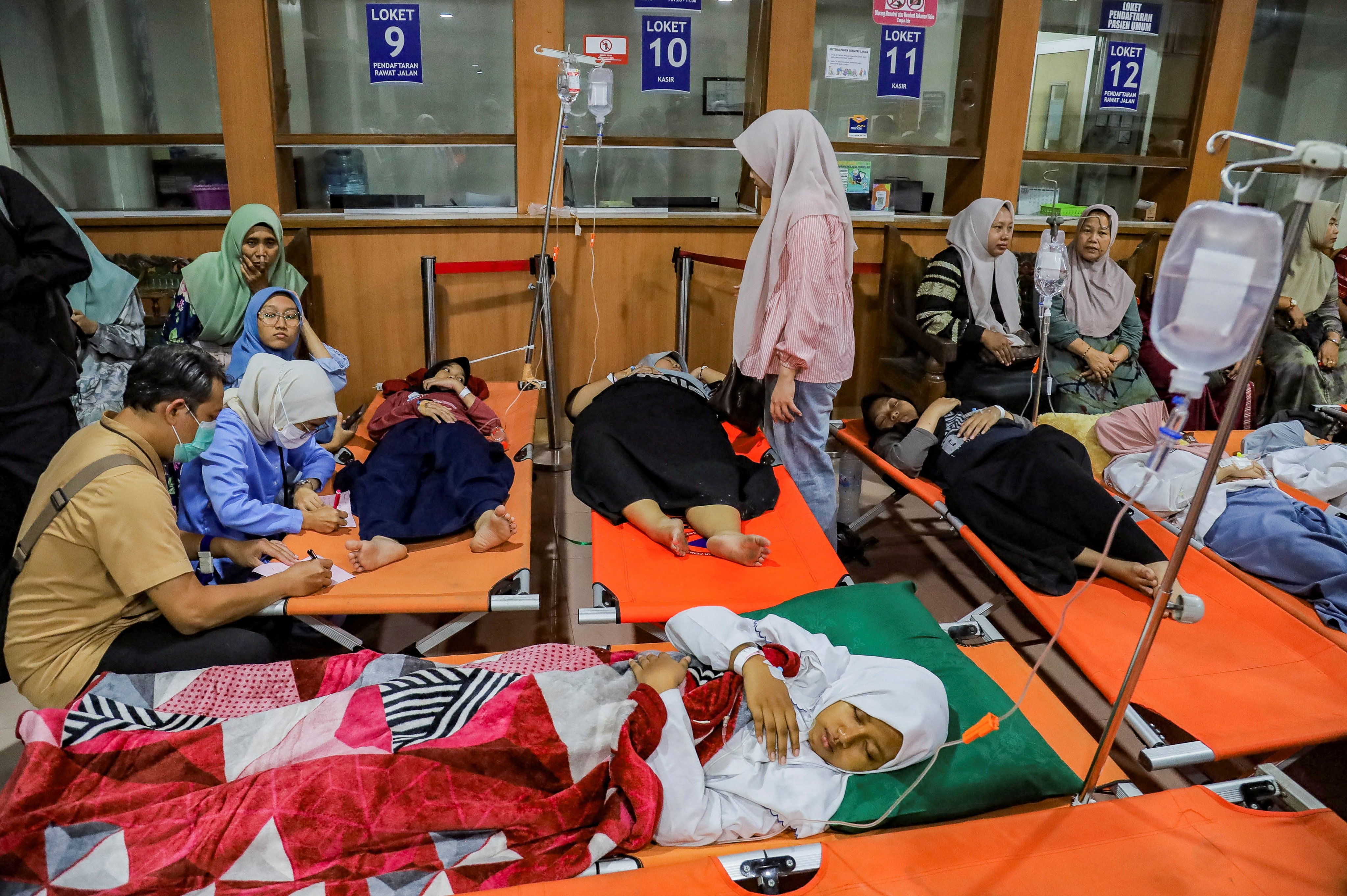 Students rest while receiving treatment for food poisoning at the regional general hospital after eating government-sponsored free school meals in Sidoarjo, East Java province, Indonesia, September 2, 2026. REUTERS/Suryanto