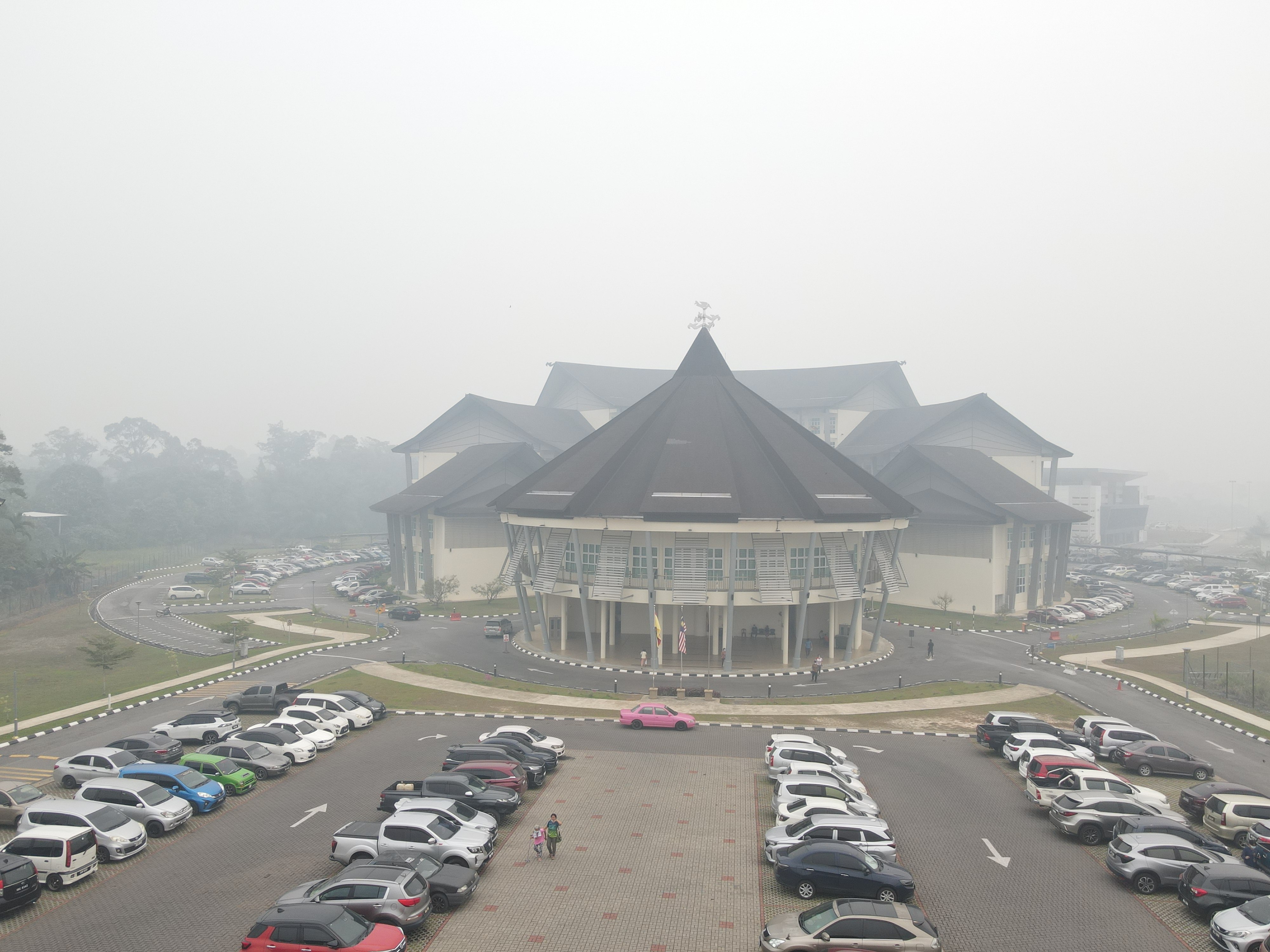 The Sarawak Government Administrative Centre in Serian is shrouded in thick haze on Friday. Photo: AP