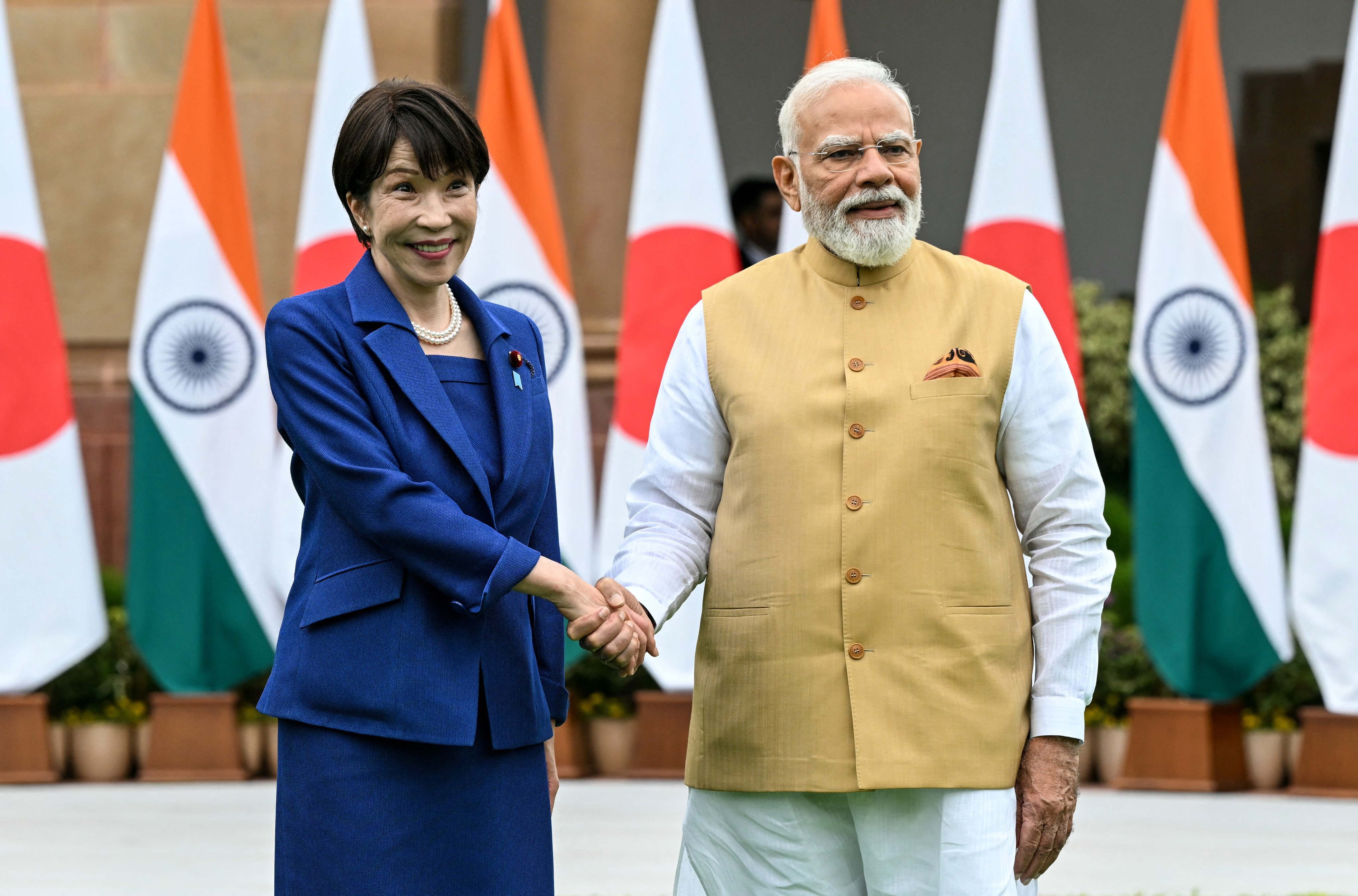 India’s Prime Minister Narendra Modi (right) shakes hands with Japan’s Prime Minister Sanae Takaichi before their meeting in New Delhi on July 2. Photo: AFP
