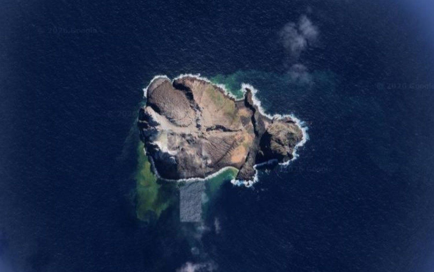 The volcanic islands of Matthew (pictured) and Hunter lie several hundred kilometres east of the French overseas territory of New Caledonia but are also claimed by Vanuatu. Photo: Google Maps