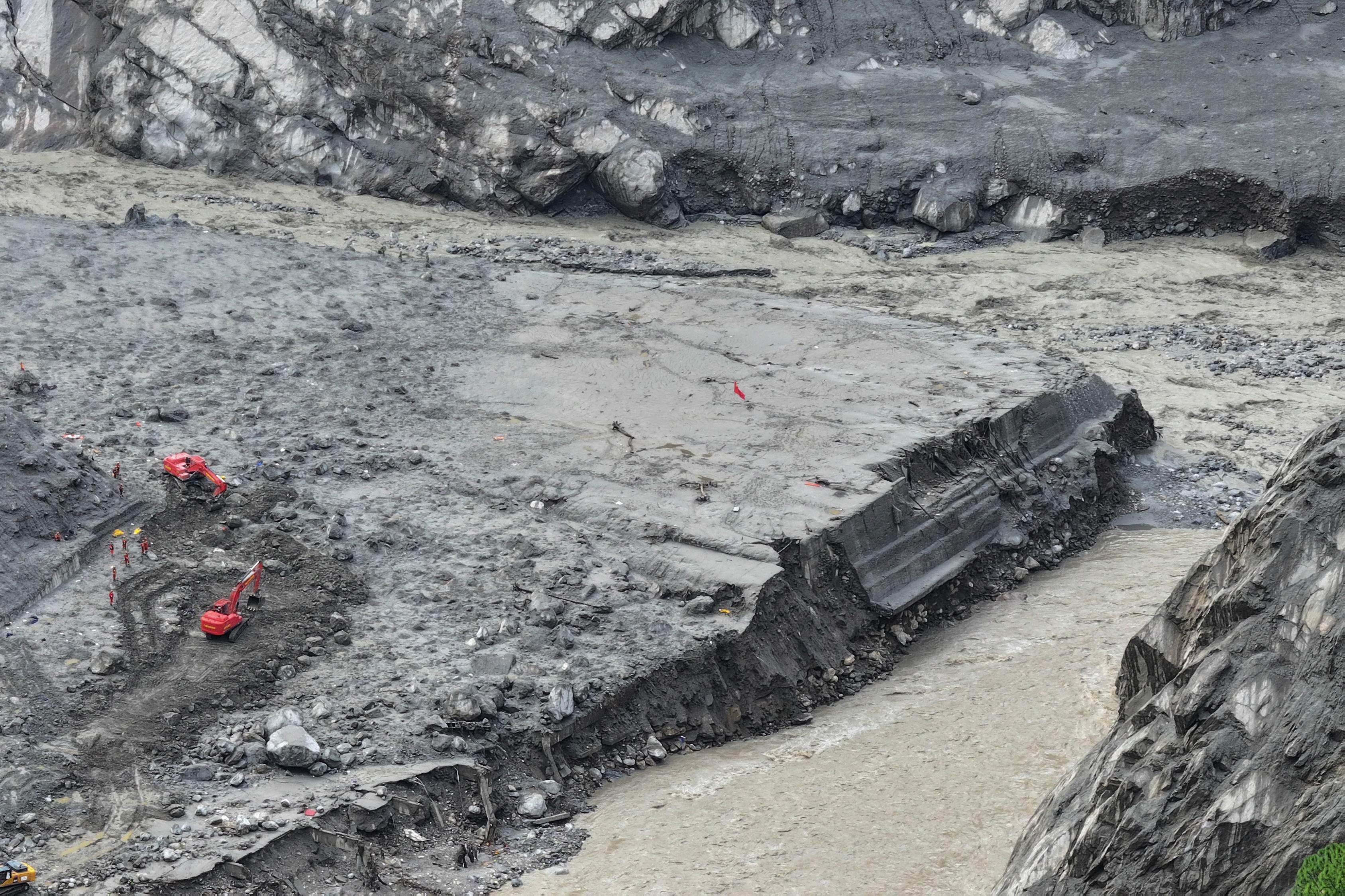 Rescue crews work at the former site of the Gyirong Port in Tibet, which was destroyed by a mudslide on August 26. Photo: CNS / AFP