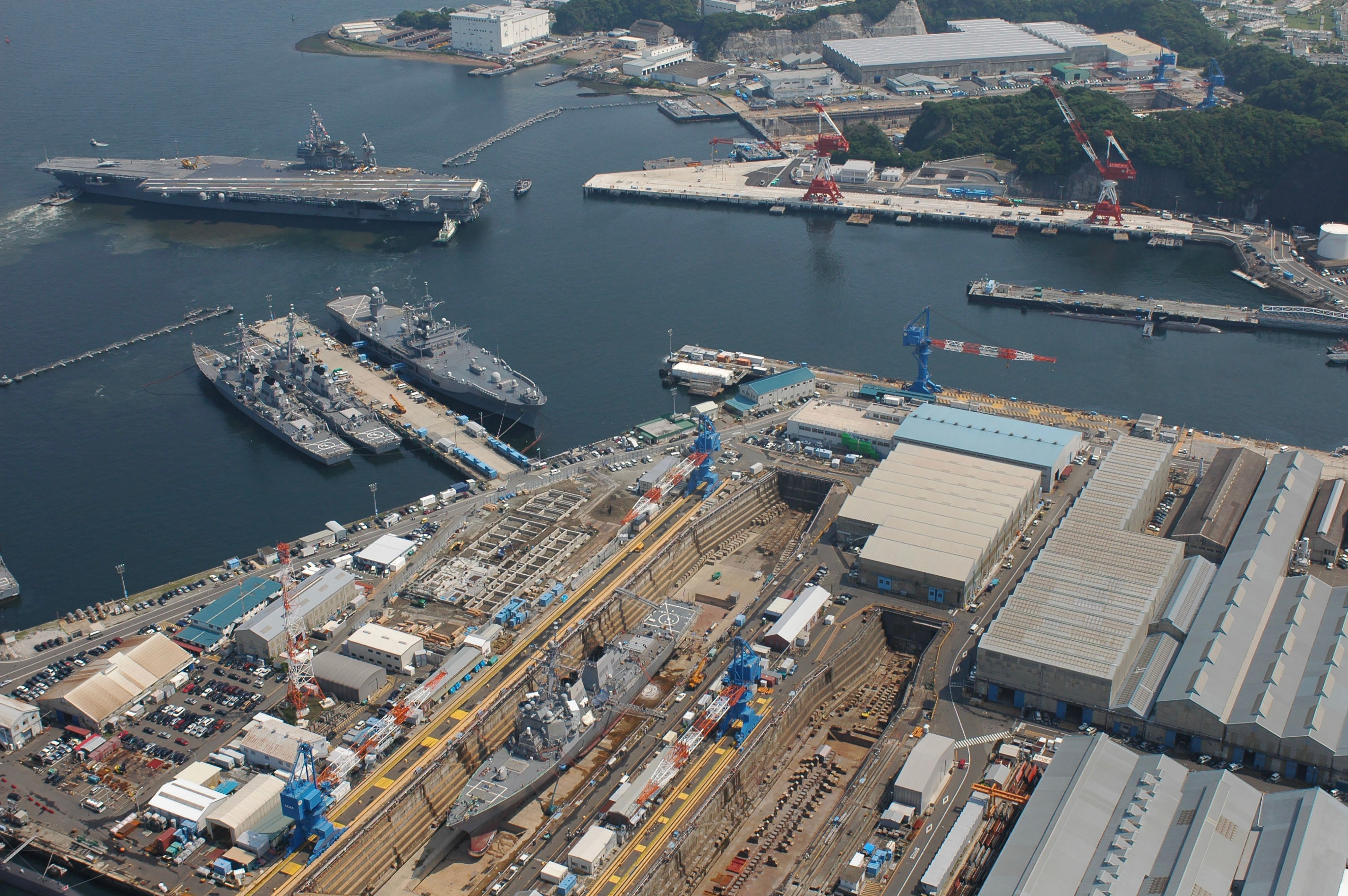 The USS Kitty Hawk backs into pier in Yokosuka, Japan. The ship repair capacity of regional allies in the western Pacific is essential to US naval capabilities. Photo: US Navy