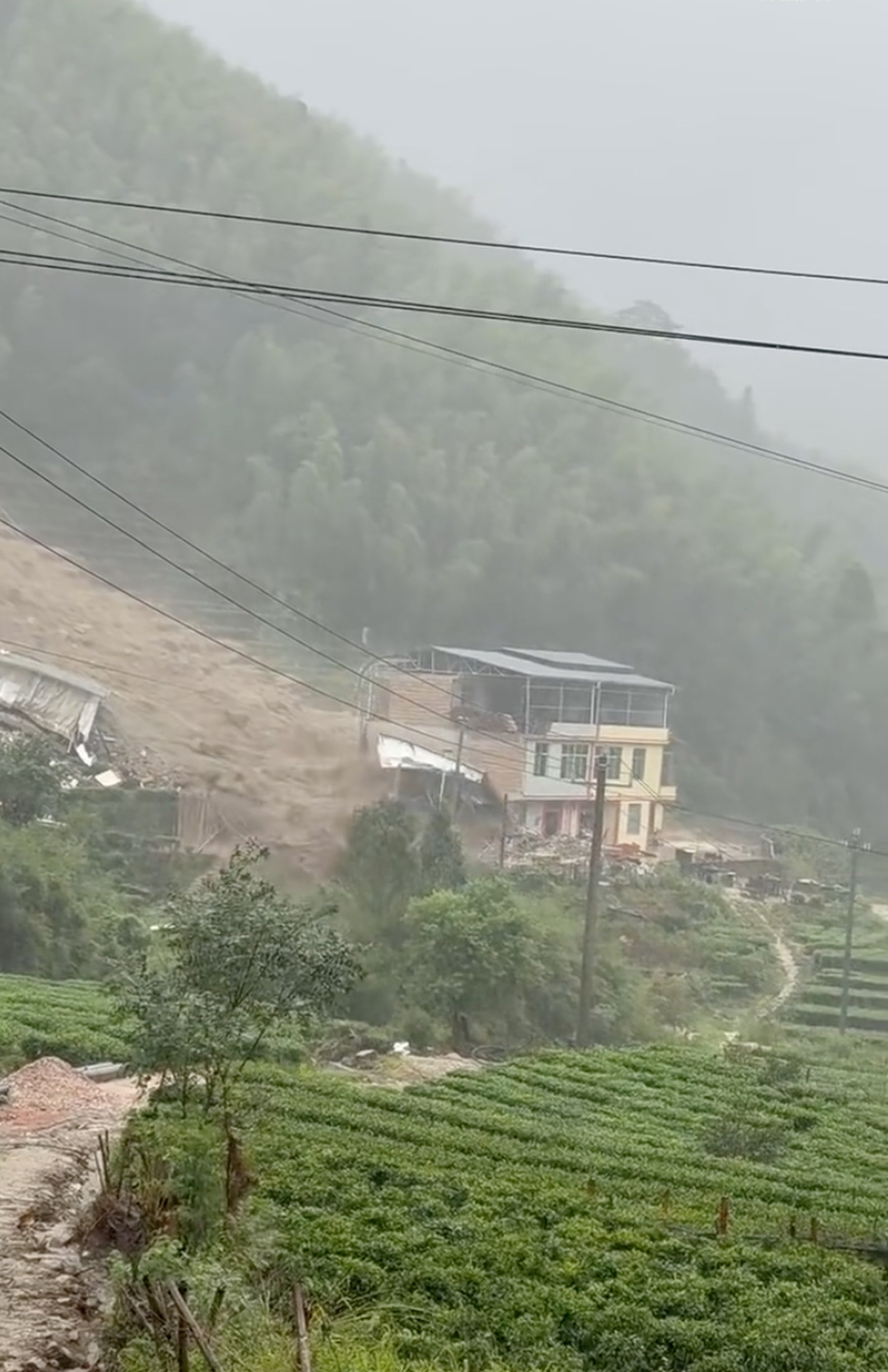 The landslide struck in an area that had been battered by heavy rains. Photo: Weibo