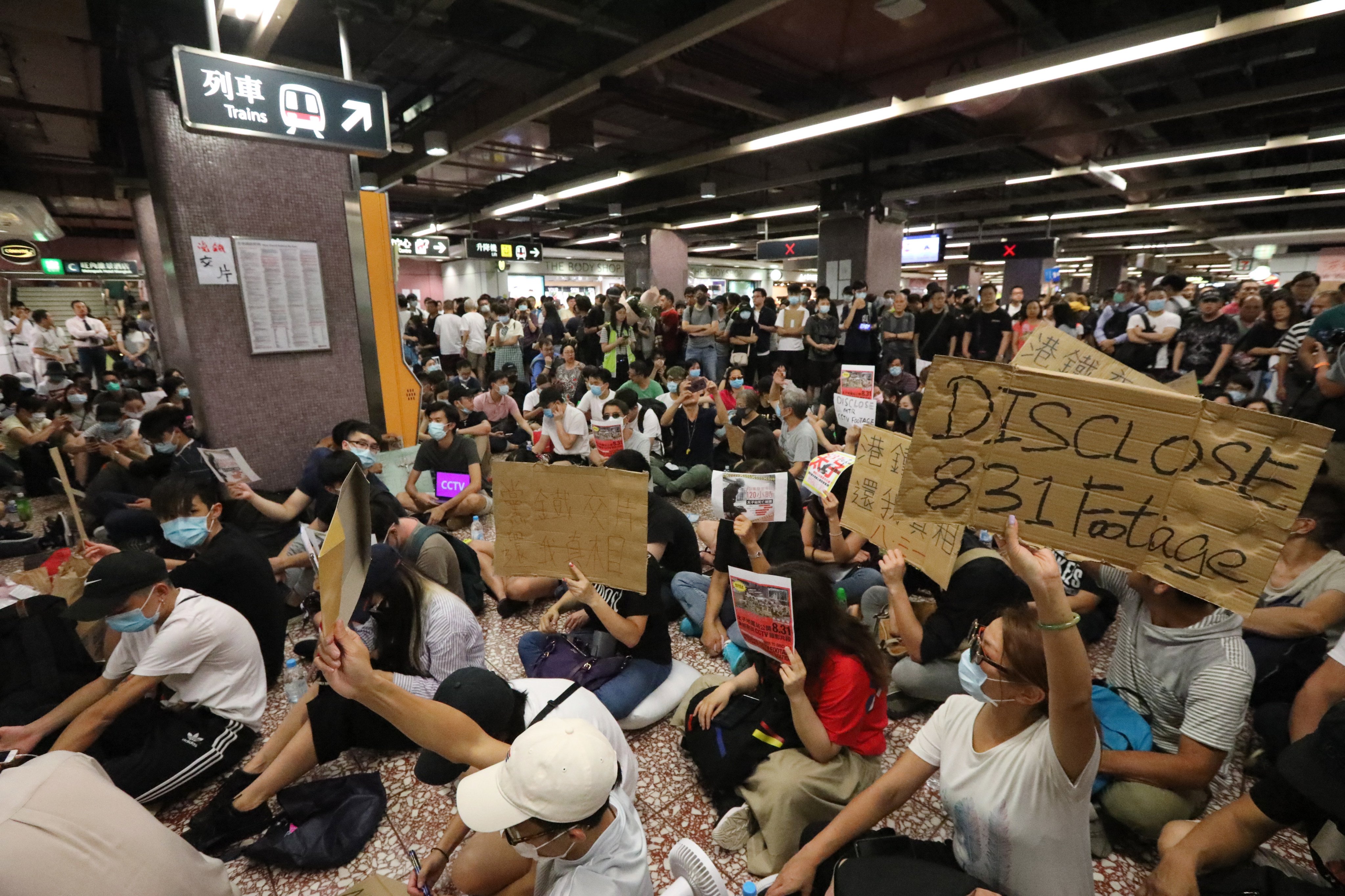 Anti-government protestors perform a sit-in at Prince Edward MTR station in 2019. Photo: Felix Wong