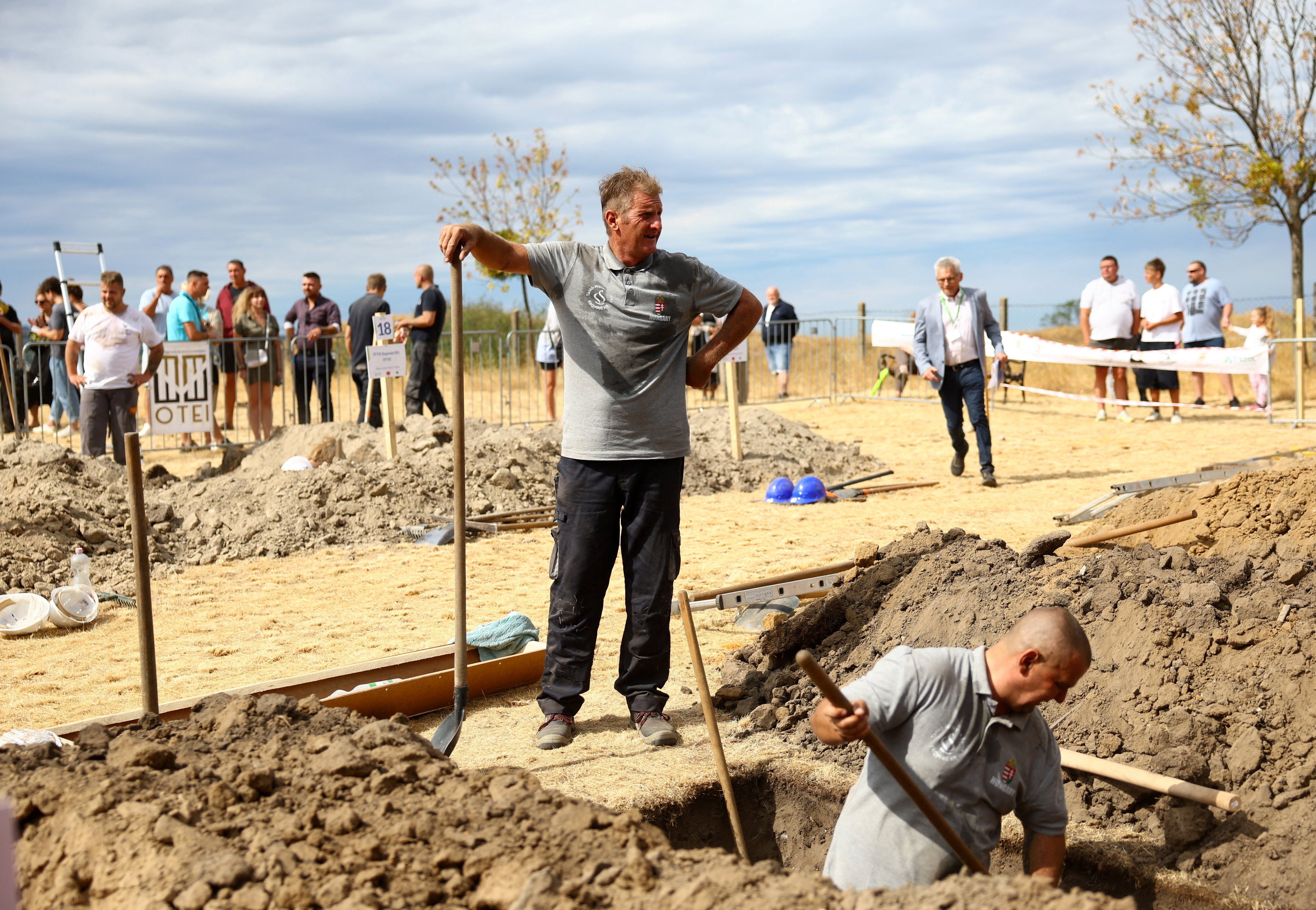Gravediggers during as international gravedigging championship in Nyergesujfalu, Hungary on Saturday. Photo: Reuters