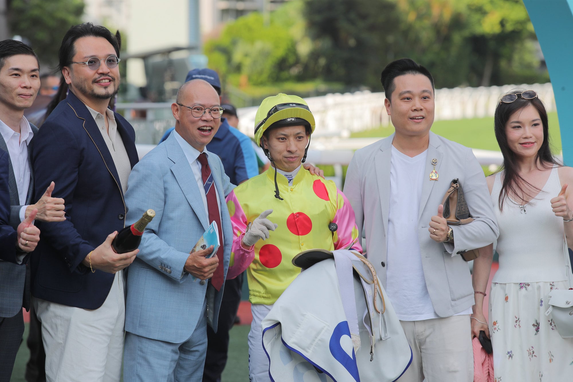 Trainer Chris So (third from left), jockey Matthew Chadwick and connections celebrate Sing Dragon’s victory. Trainer Chris So (third from left), jockey Matthew Chadwick and connections celebrate Sing Dragon’s victory.