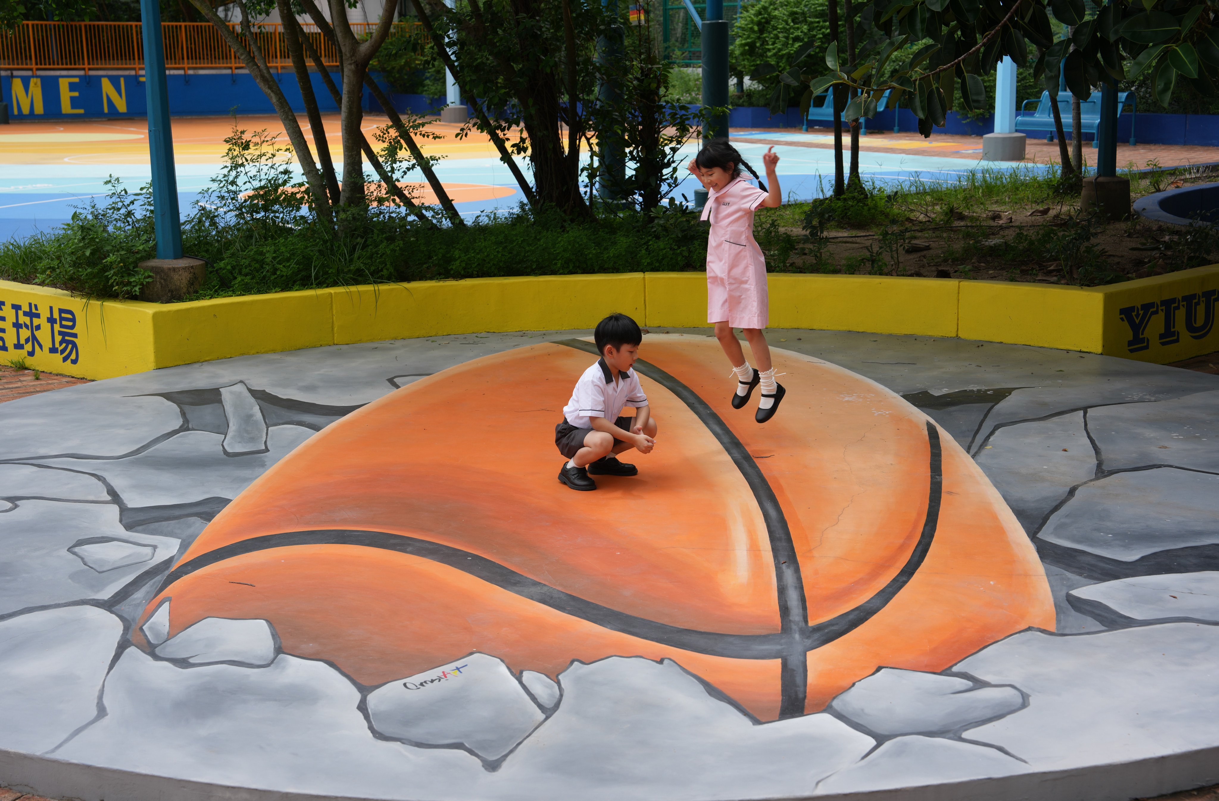 Students play on a 3D painting after school at Yiu Tung Estate, Shau Kei Wan, on September 3. Photo: Sam Tsang