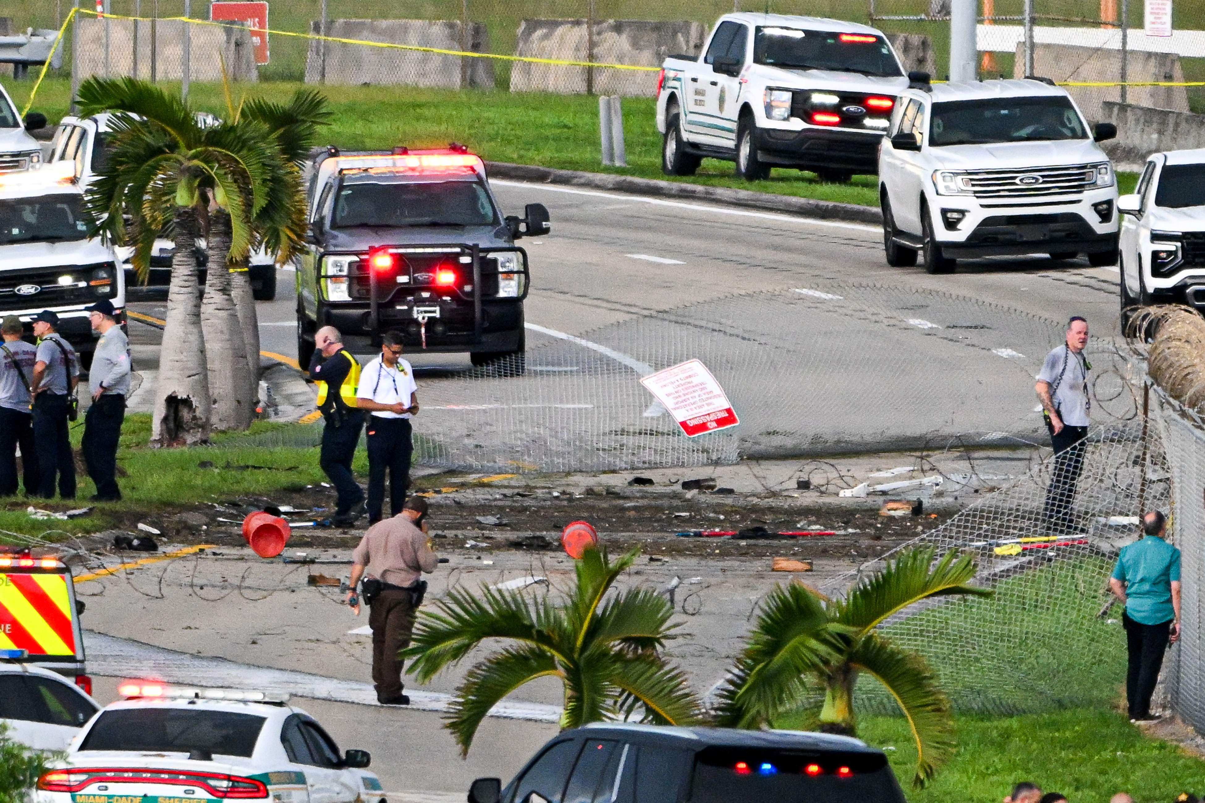 Officials investigate at the scene. Photo: AFP