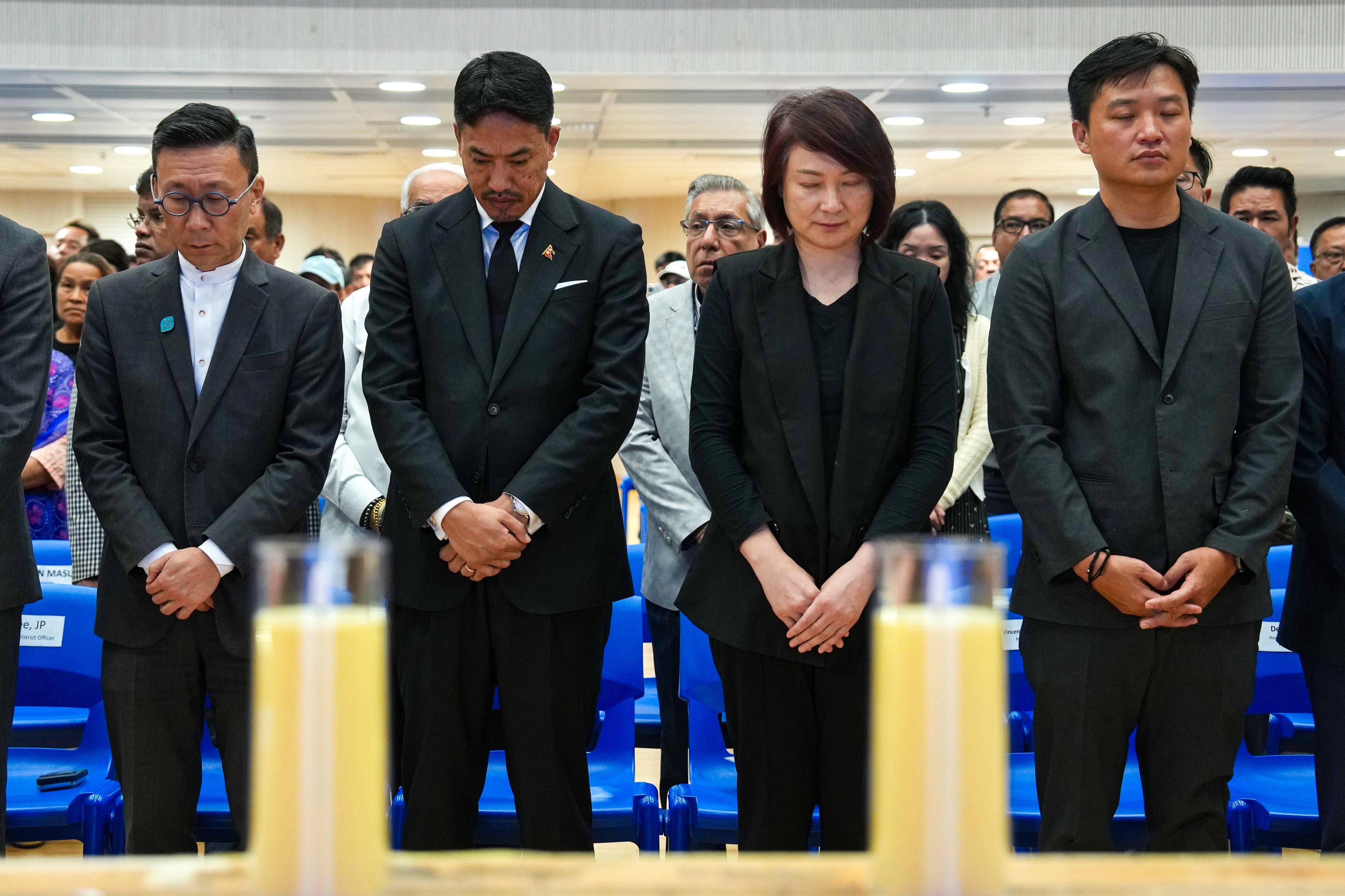 (From left) Deputy Secretary for Home and Youth Affairs Paul Wong, Nepal's acting consul general Satish Gurung, Legislative Council president Starry Lee and lawmaker Vincent Cheng observe a moment of silence for victims of the flash flood. Photo: Kit Lai
