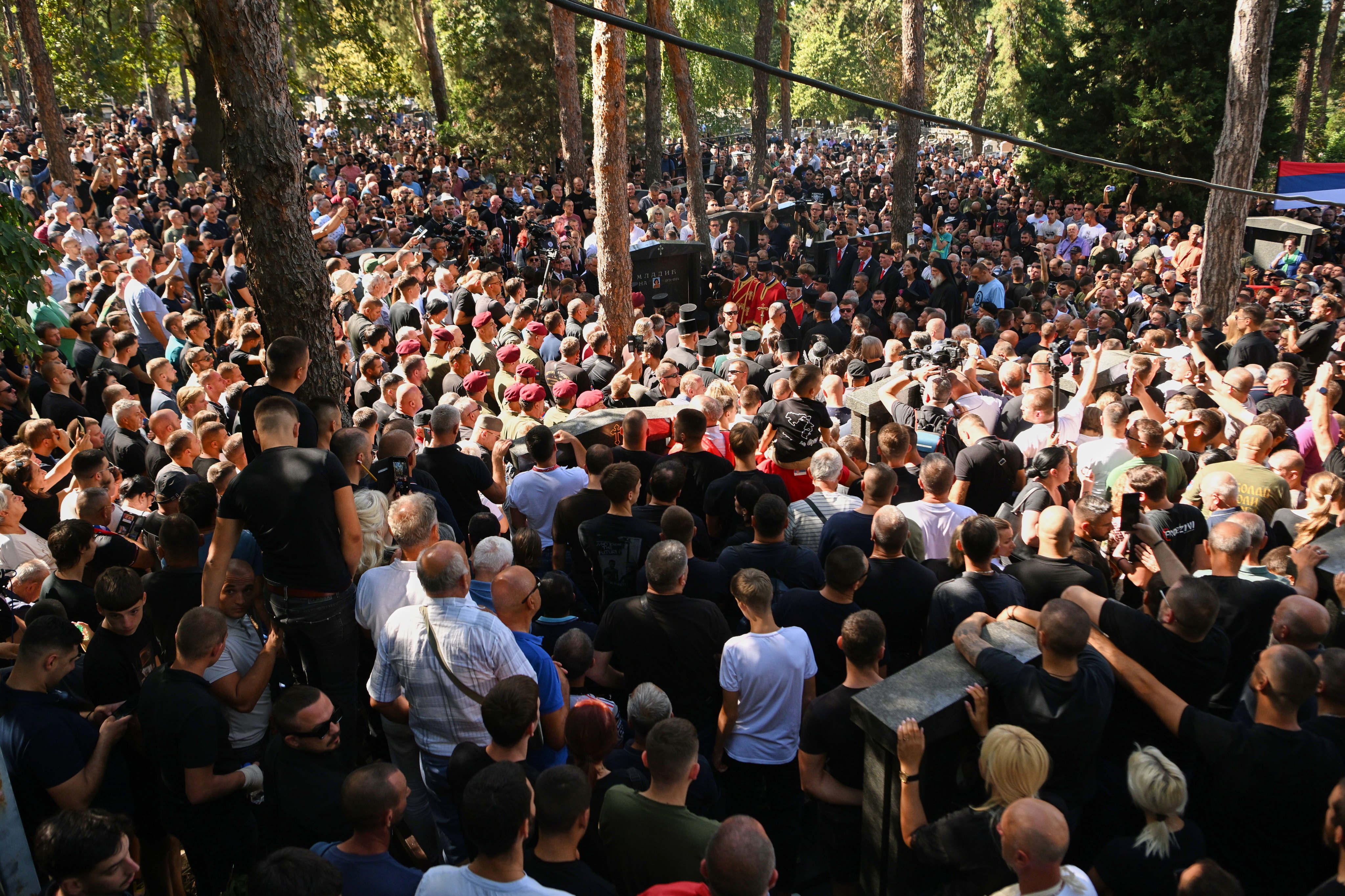 People gather around the grave of Mladic's grave. Photo: AP