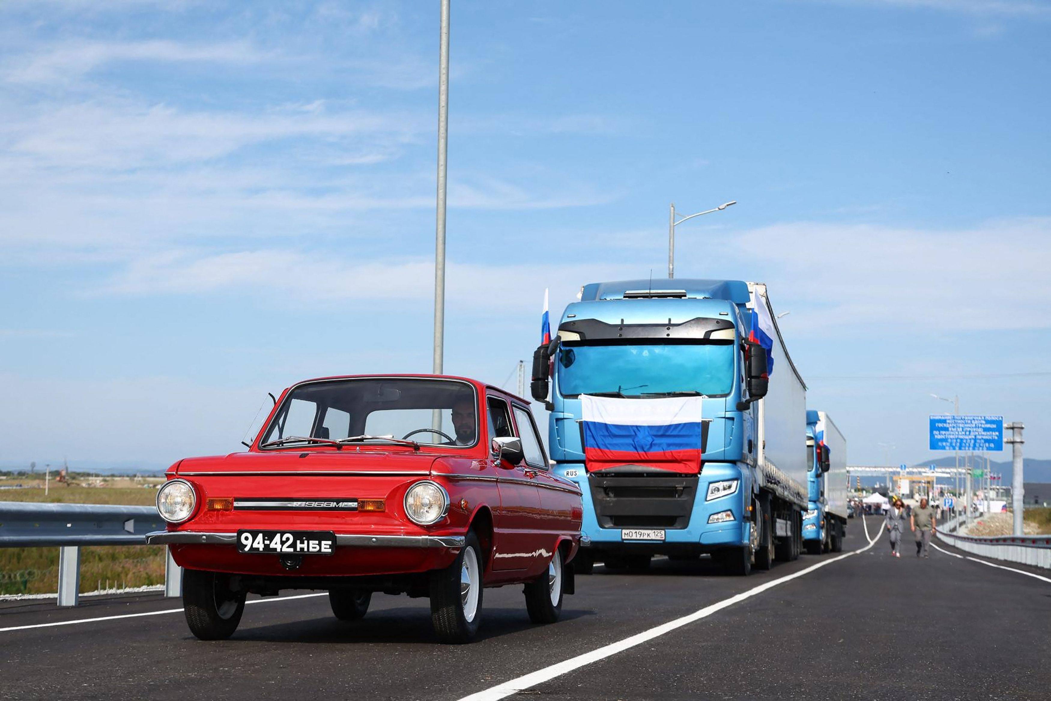 Russian vehicles cross the new Russia-North Korea road bridge over the Tumen river, during the opening ceremony. Photo: Handout / Russian Transport Ministry / AFP