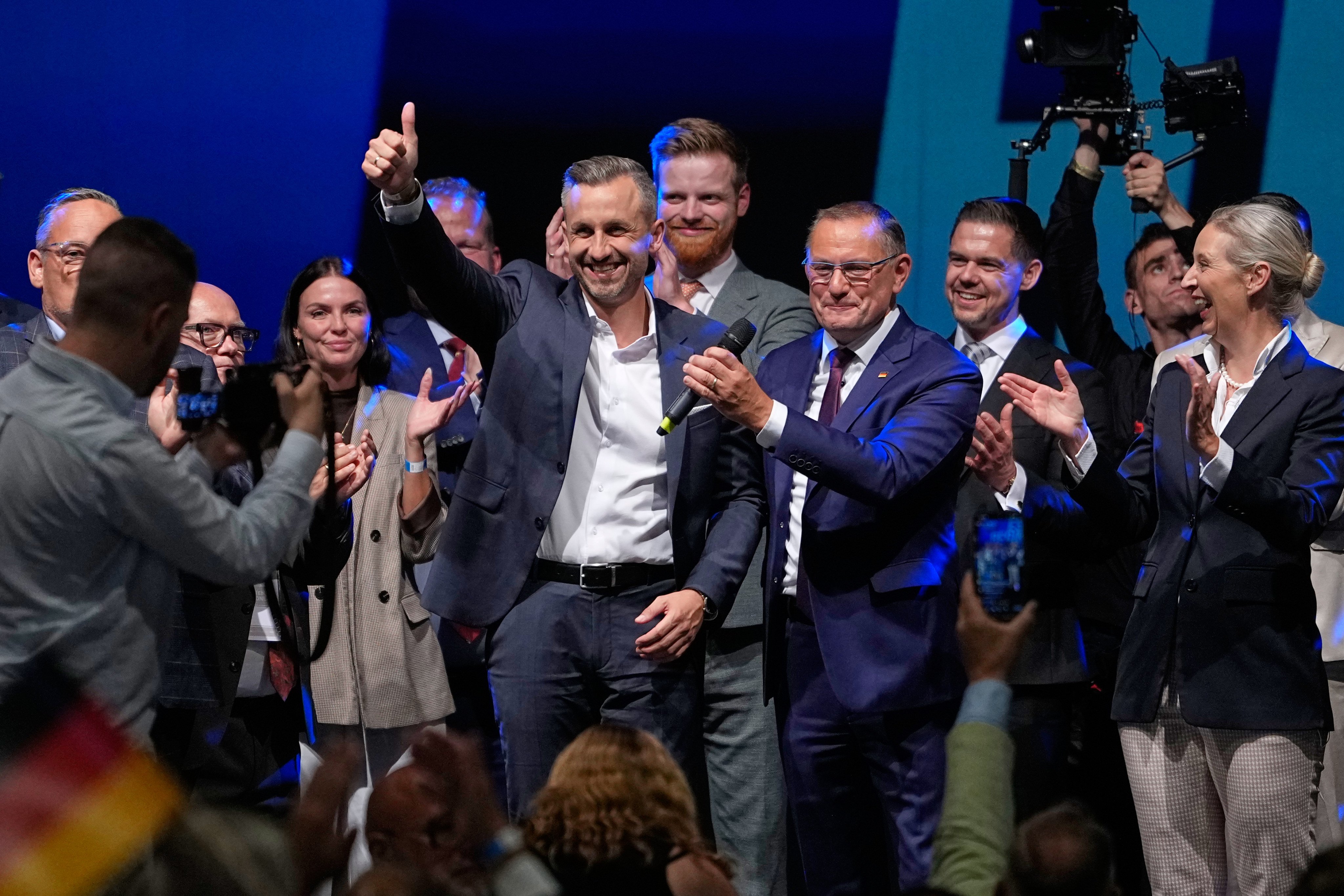 AfD candidate Ulrich Siegmund celebrates at an election party alongside AfD leaders. Photo: AP