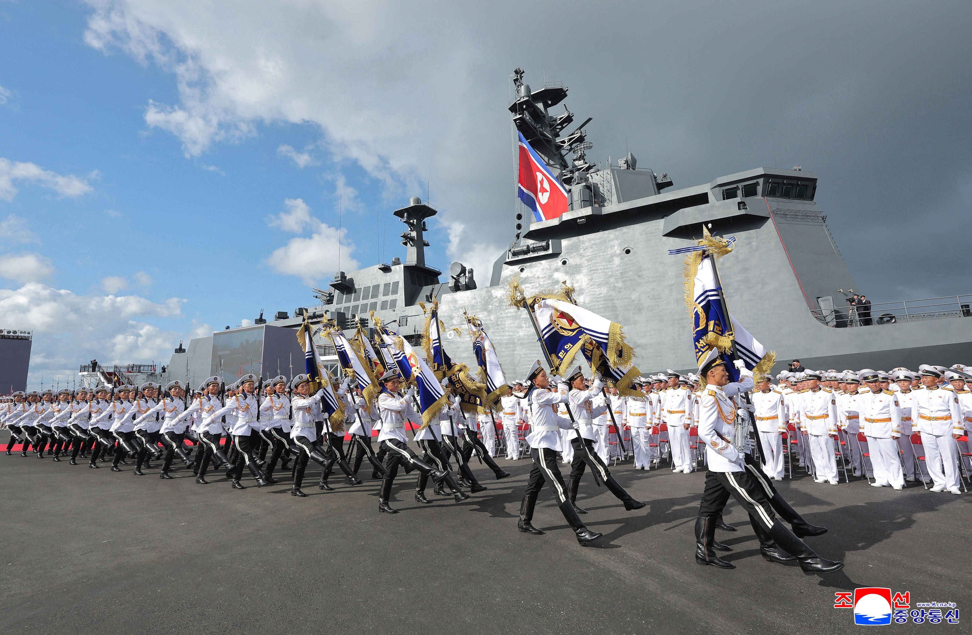 North Korean sailors march past the Kang Kon during its commissioning ceremony at Wonsan Port on Sunday. Photo: KCNA / AFP