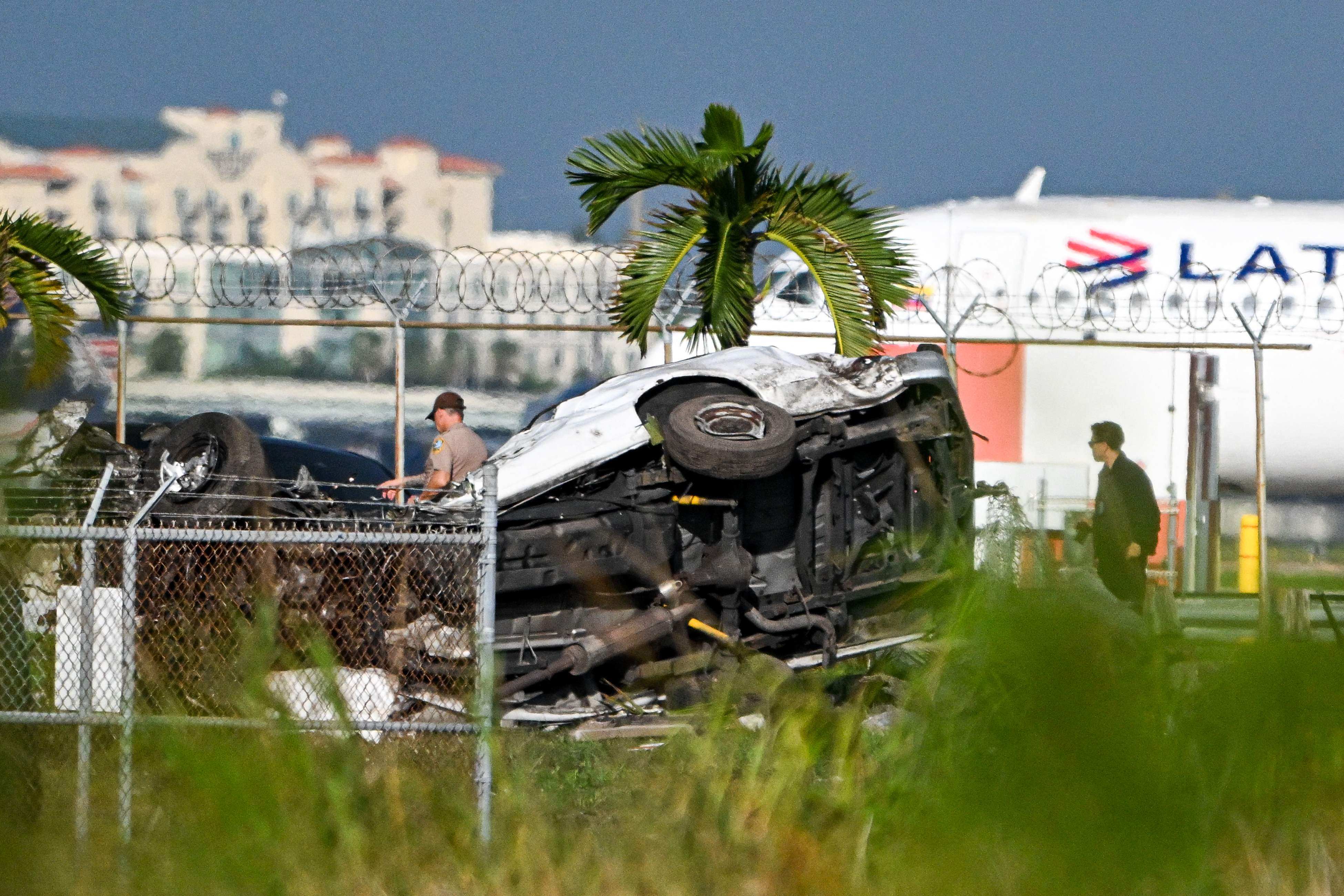 Overturned, damaged cars. Photo: AFP
