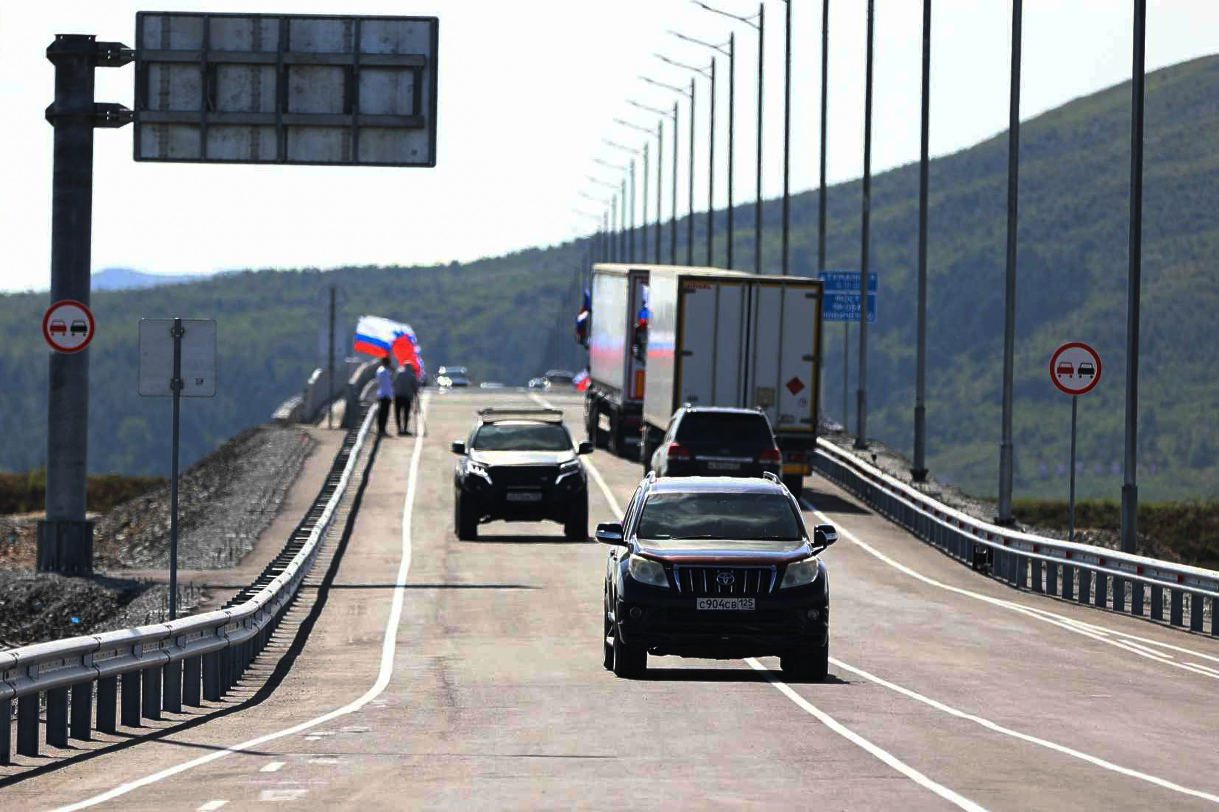 Vehicles drive across the new bridge between Russia and North Korea over the Tumen river in Russia’s Primorsky Krai region, on Monday. Photo: Government of Primorsky Krai Region via AP