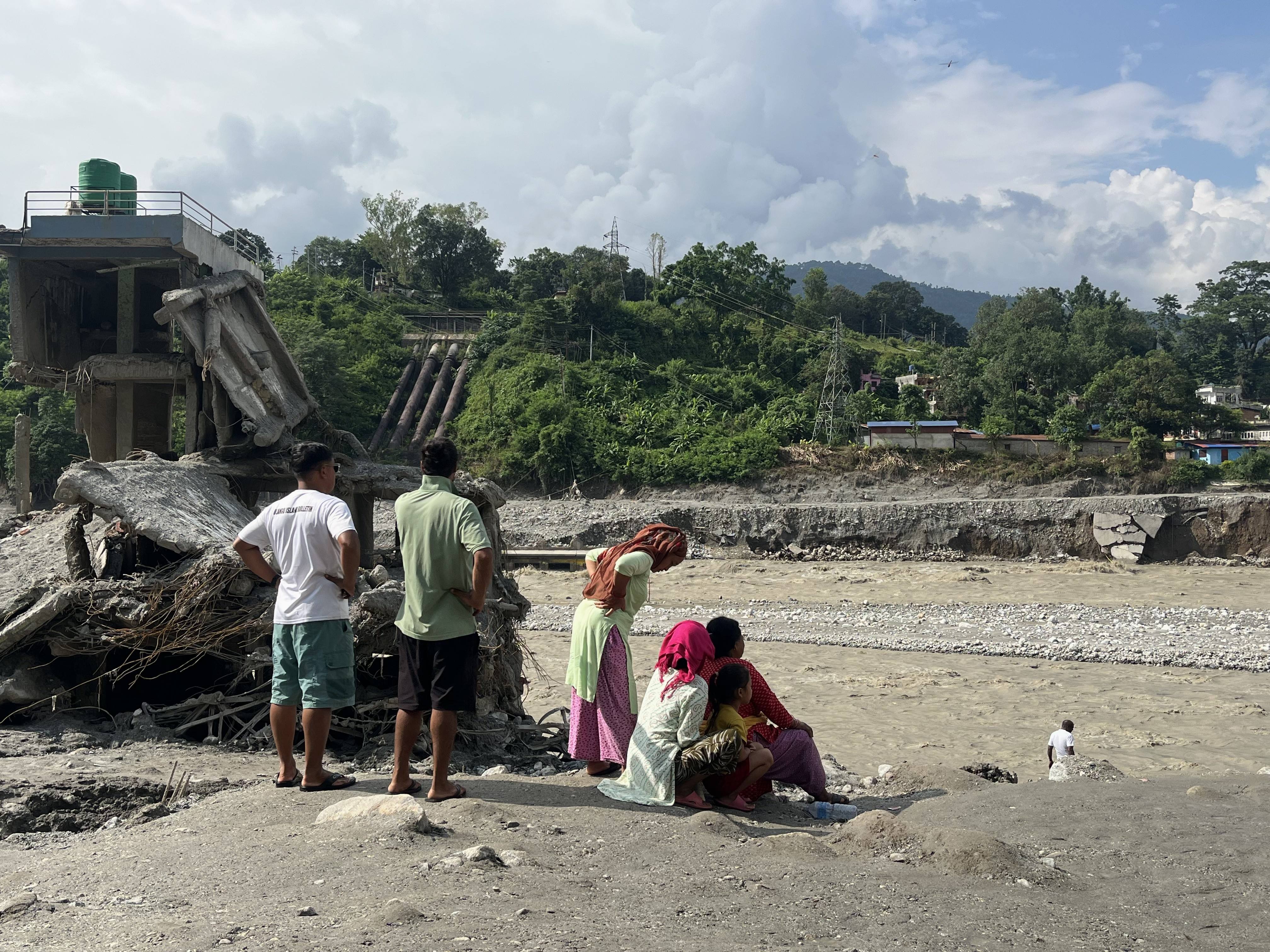 People look at the destruction in Dhunge Bazaar, Nuwakot, Nepal. Photo: Bibek Bhandari