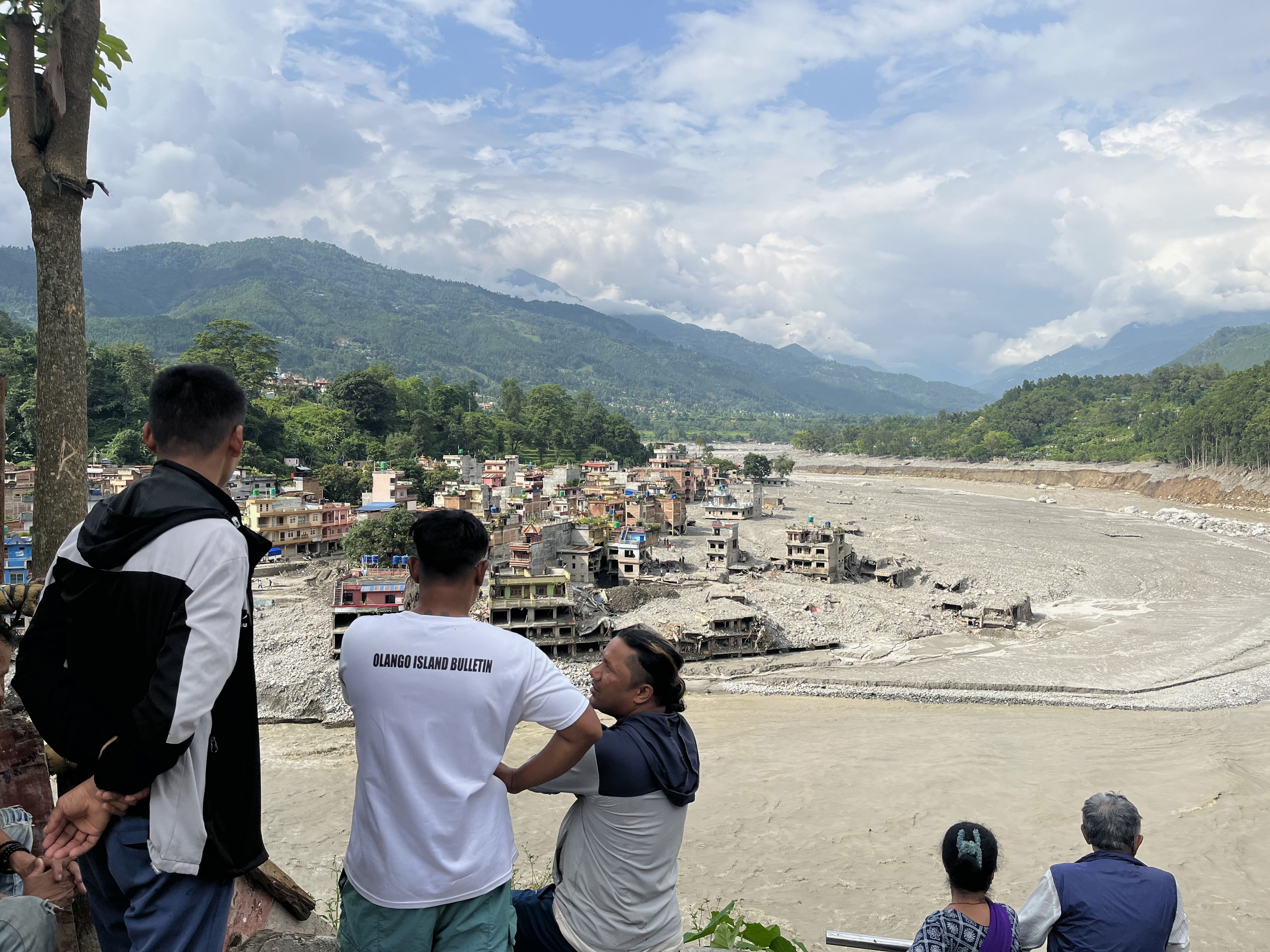 People take stock of the devastation across the Trishuli River. Photo: Bibek Bhandari