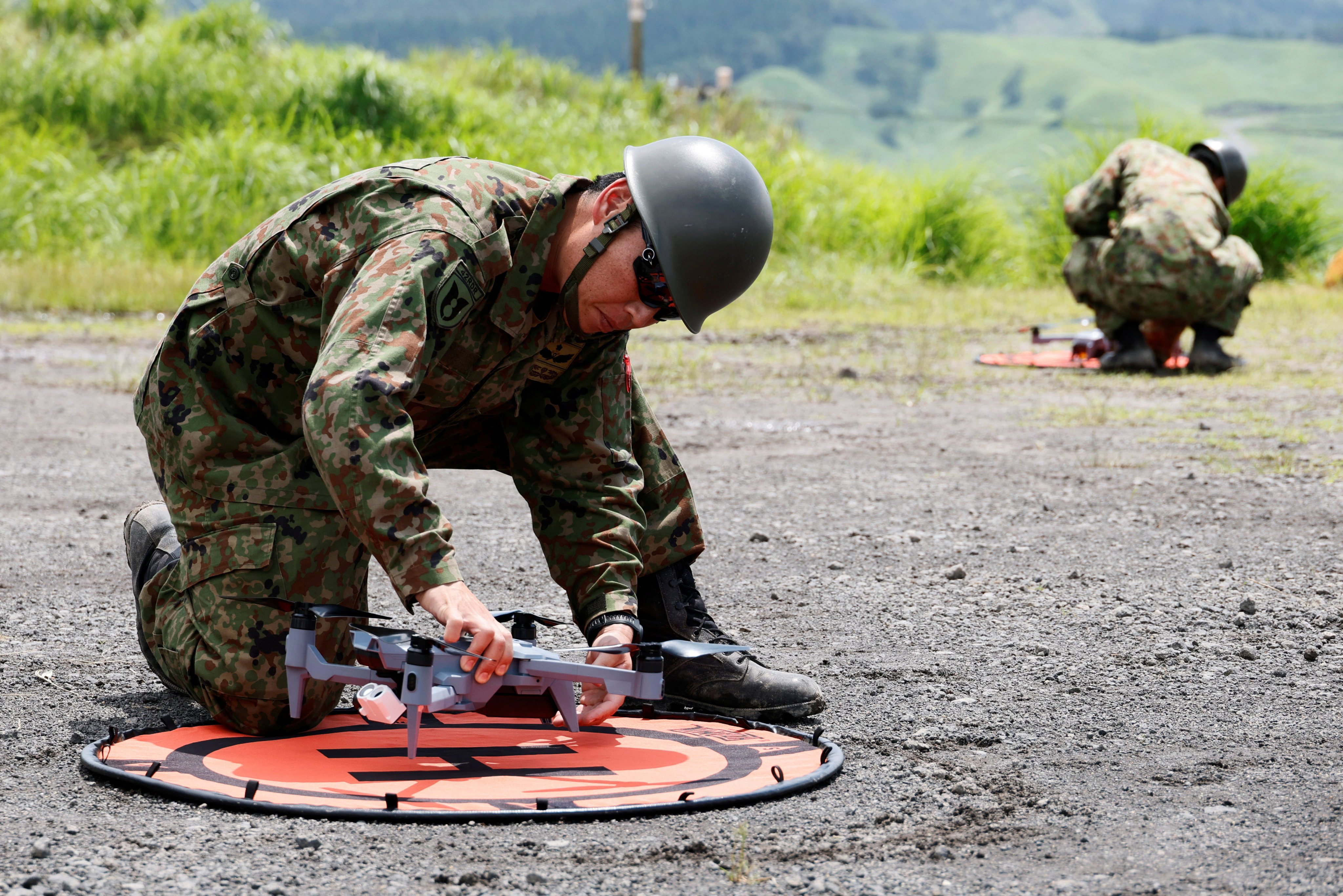 Members of the Japan's Self-Defence Forces check drones during a joint drill with US marines in Oita prefecture in June. Photo: Reuters