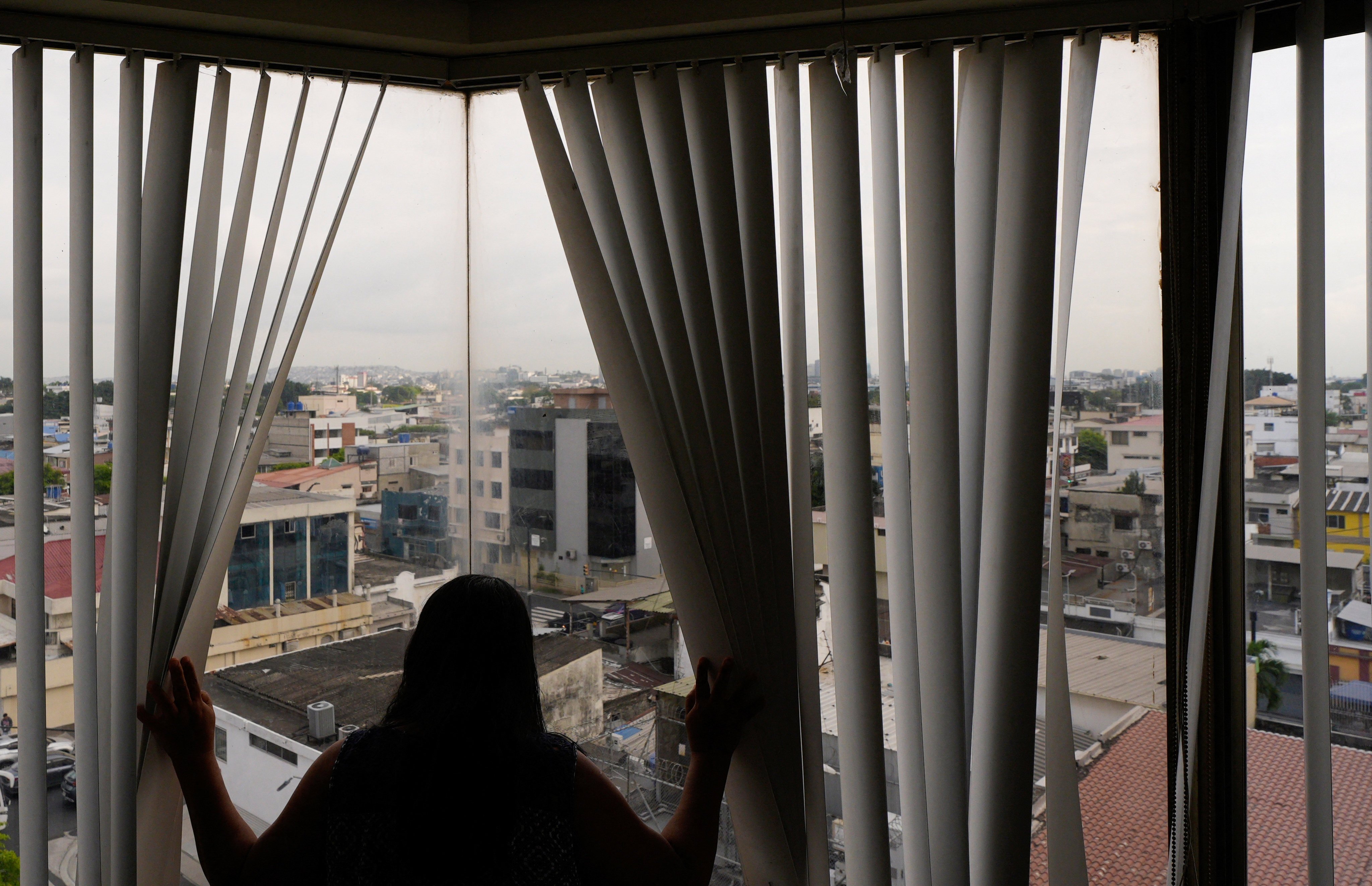 A woman displaced by gang violence poses for a photo during an interview in Guayaquil, Ecuador, in July. Photo: Reuters