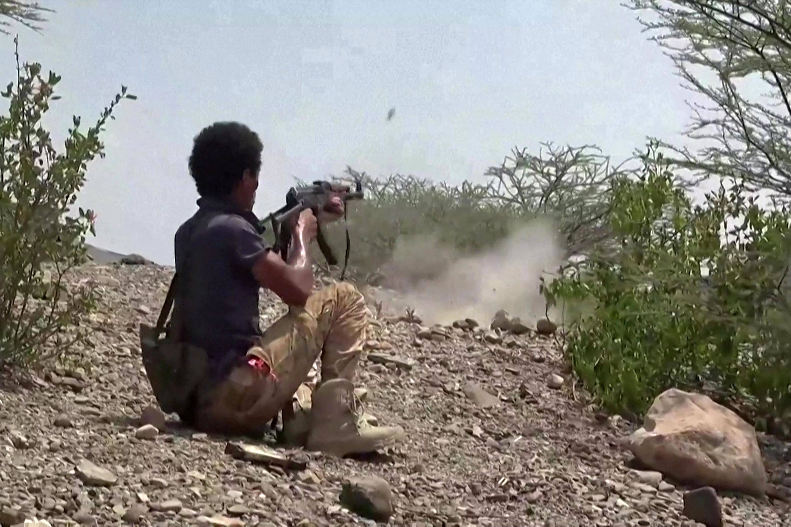A fighter firing an assault rifle west of the city of Taiz in Yemen’s western Taiz province on Tuesday. Photo: AFP