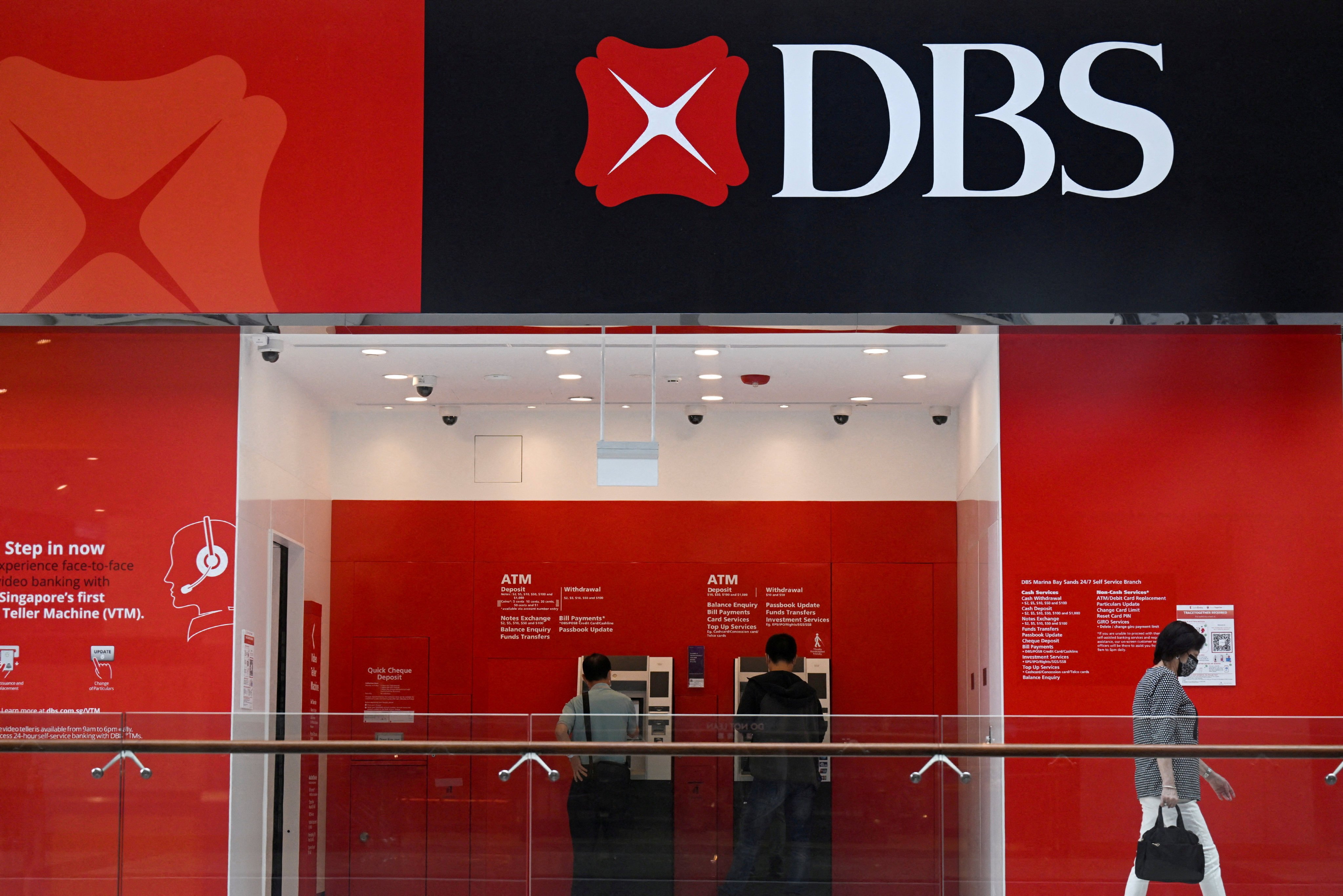 People use DBS automated teller machines in Singapore. Photo: Reuters