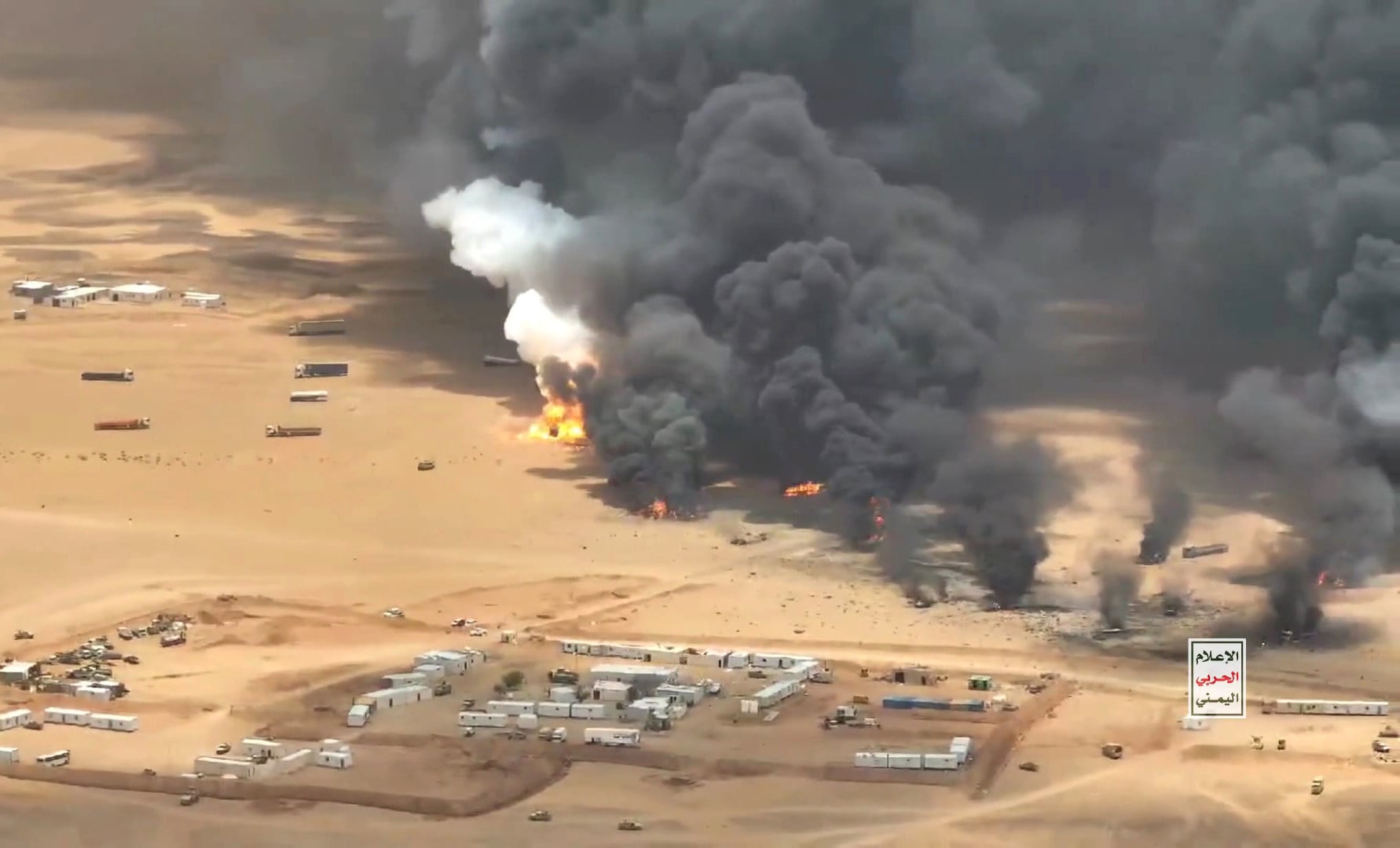 Trucks burn after being targeted by missiles launched by Houthis near Al-Wadiah military camp in Hadramout province, Yemen on Monday. Photo: Xinhua