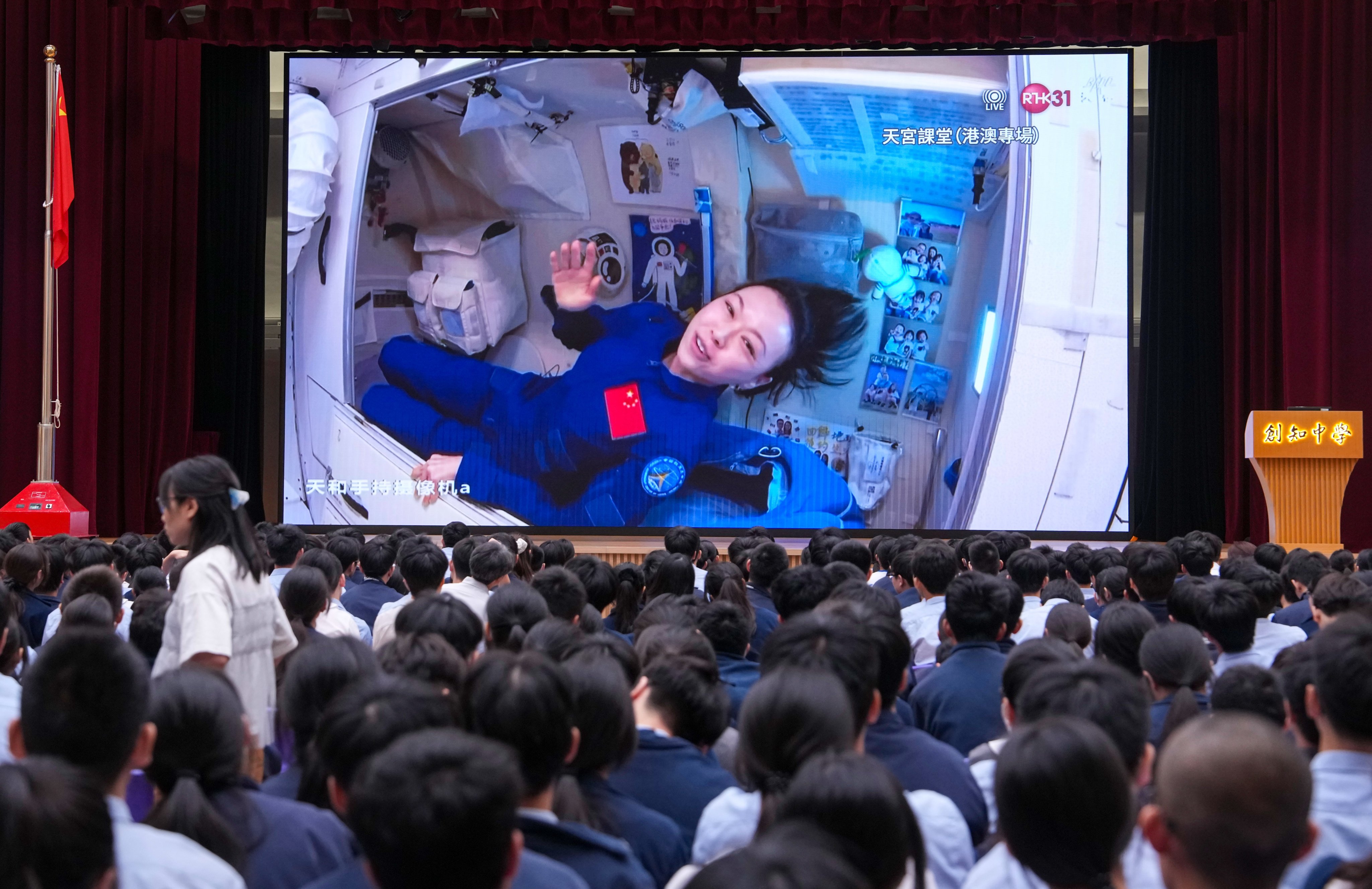 Students at Scientia Secondary School watch astronaut Lai Ka-ying’s “Tiangong lesson”, broadcast live from the Chinese space station on Wednesday. Photo: Sam Tsang