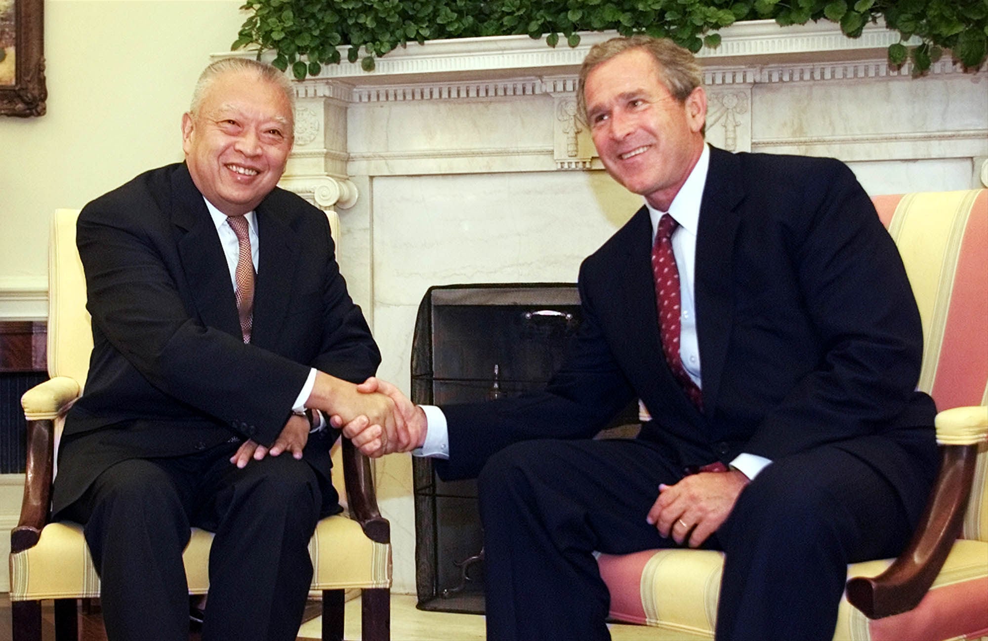 Then US president George W Bush (right) greets Tung Chee-hwa in the Oval Office on July 11, 2001. Photo: AP