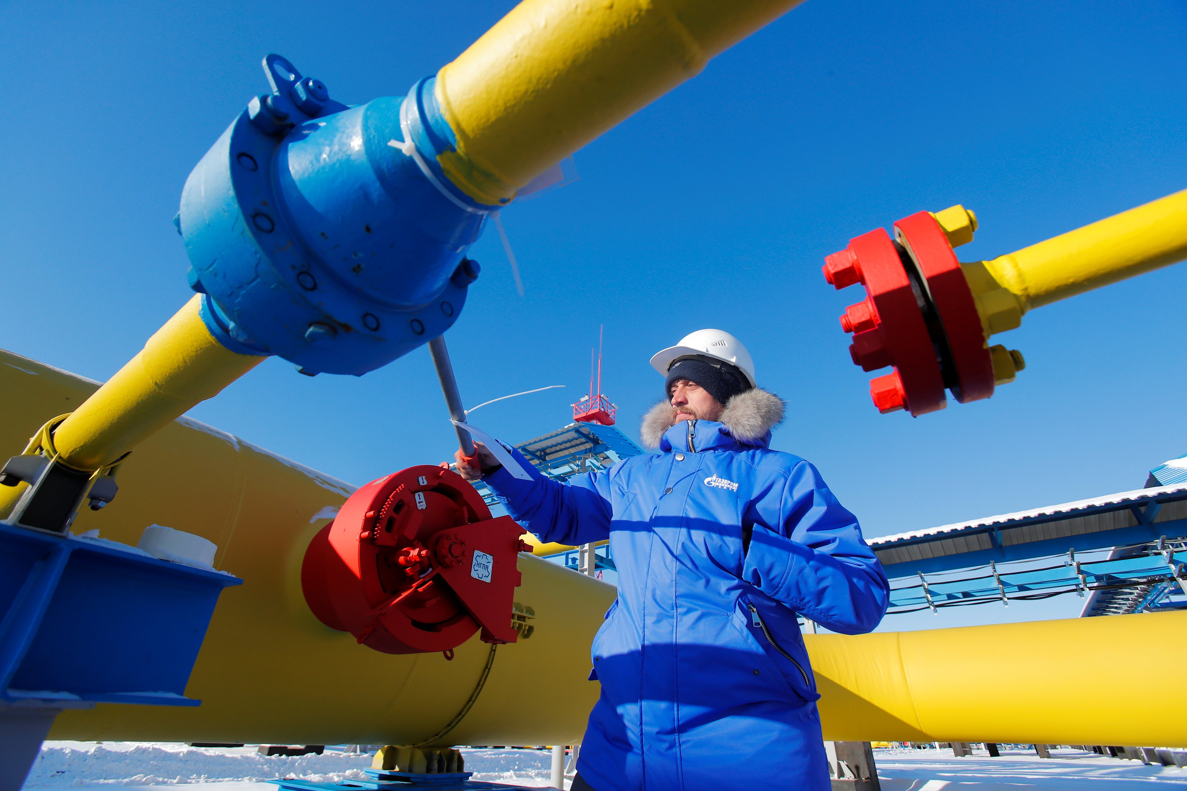 An employee checks a gas valve at the Atamanskaya compressor station, part of Gazprom’s Power of Siberia 1 gas pipeline outside the far eastern town of Svobodny, in Amur region, Russia. Photo: Reuters