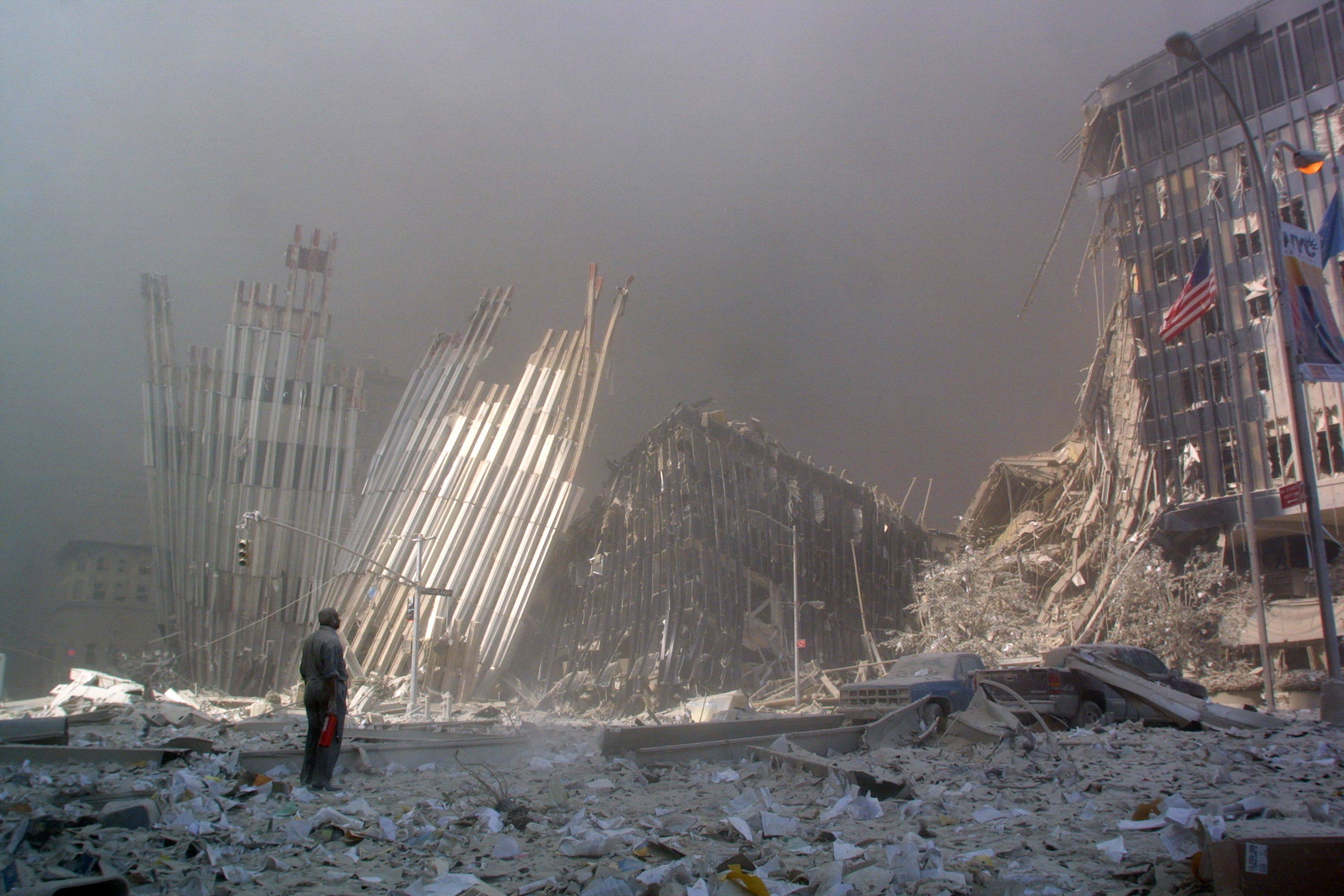 A man standing among the rubble of the Twin Towers. Photo: AFP