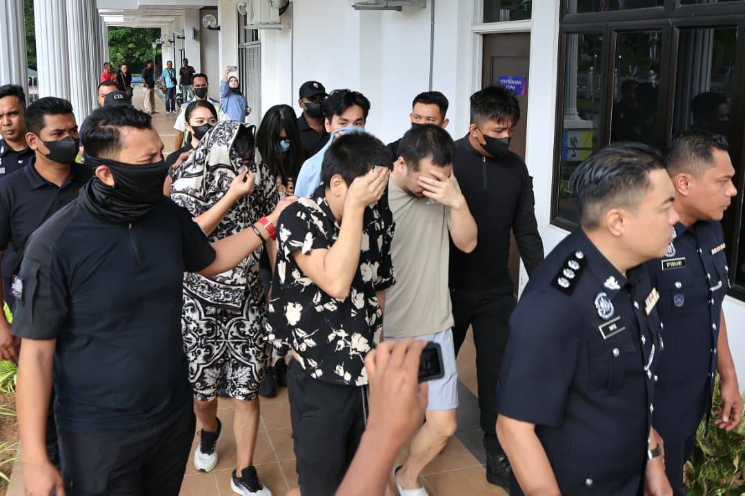 The suspects arrive at a court in Penang, Malaysia. Photo: The Star