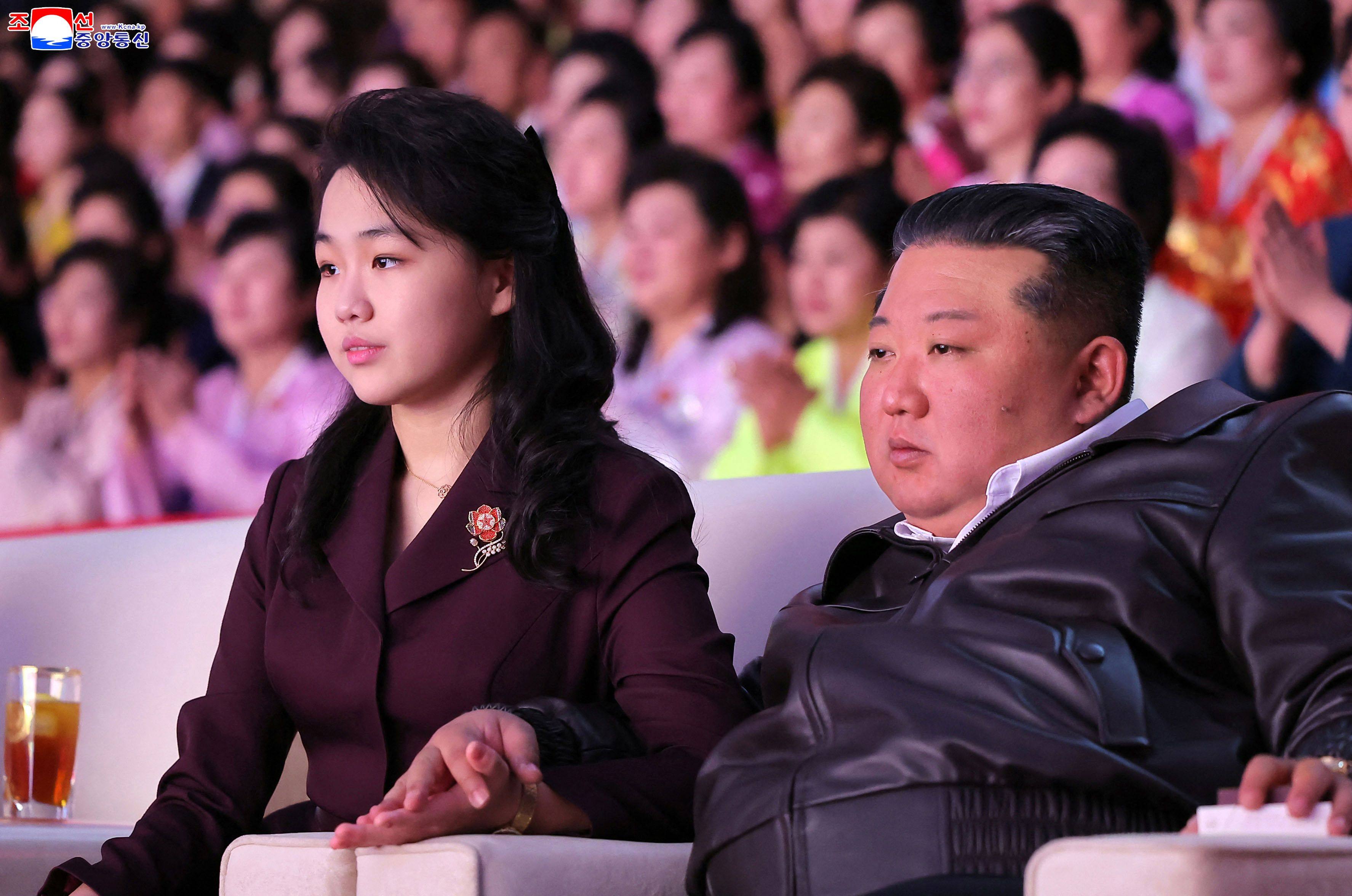 North Korean leader Kim Jong-un and his daughter Kim Ju-ae watch a performance at the Pyongyang Gymnasium in March. Photo: KCNA via KNS / AFP