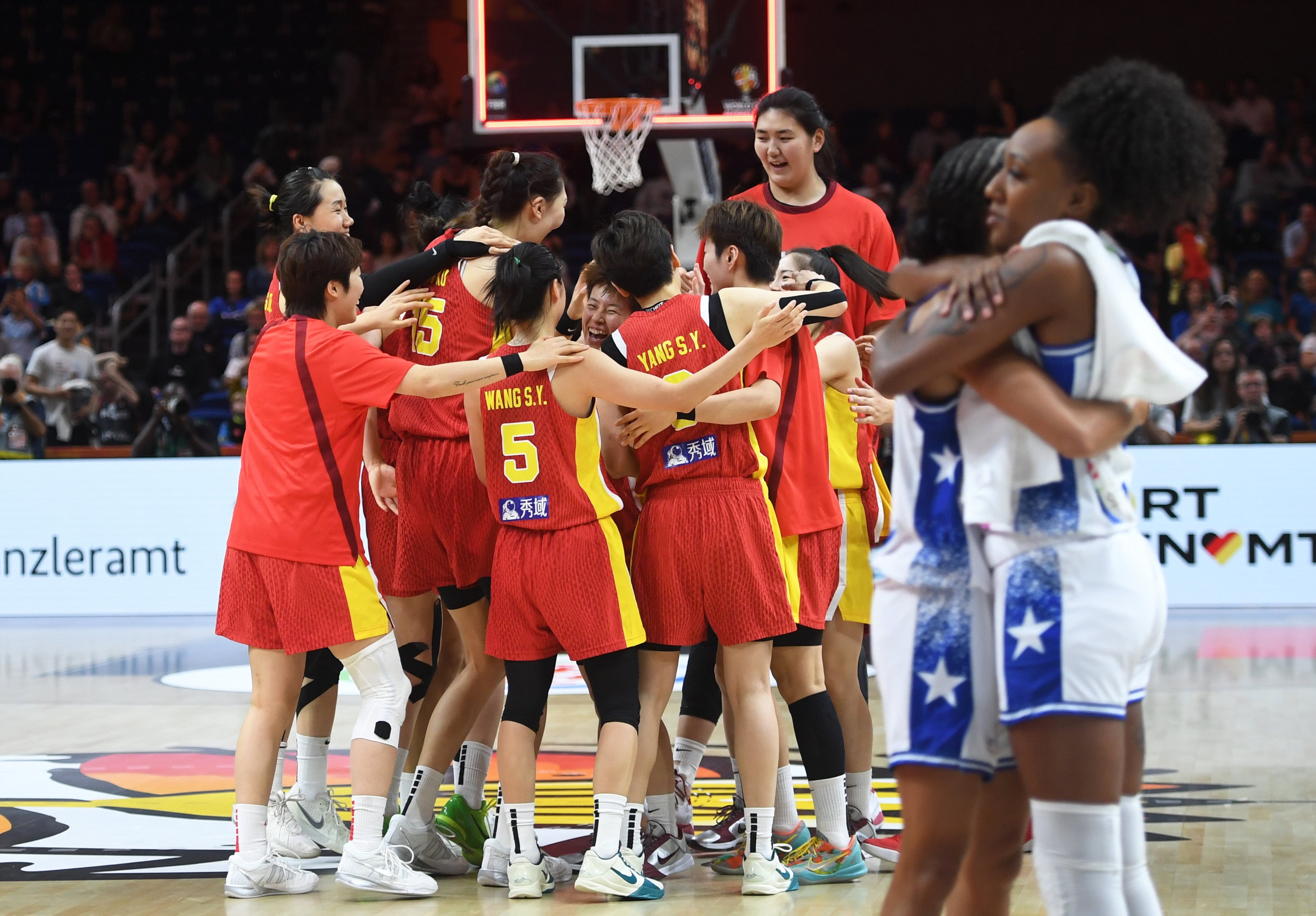 Chinese players celebrate victory after the qualification to quarter-finals match against Puerto Rico on Wednesday. Photo: Xinhua