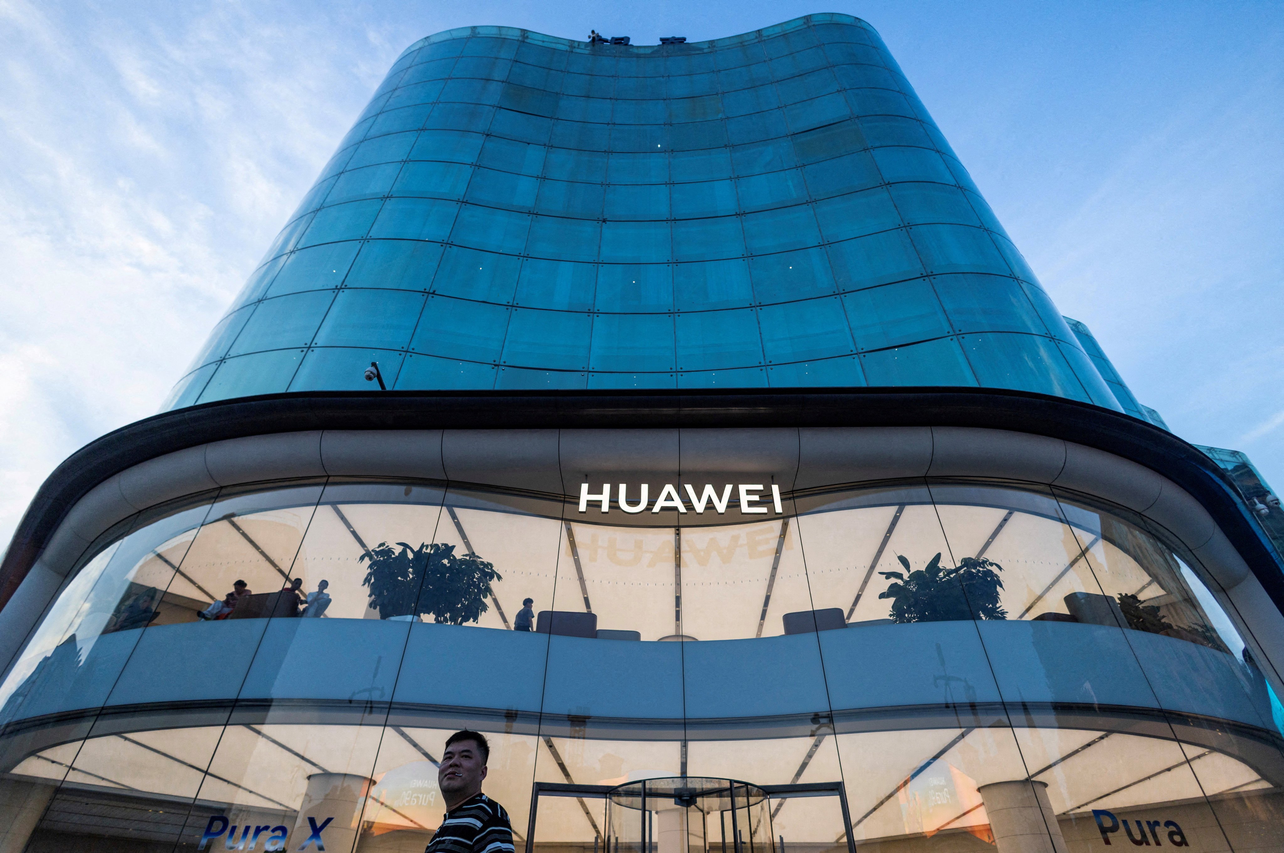 A man walks by a Huawei store in Beijing on July 8, 2026. Photo: Reuters