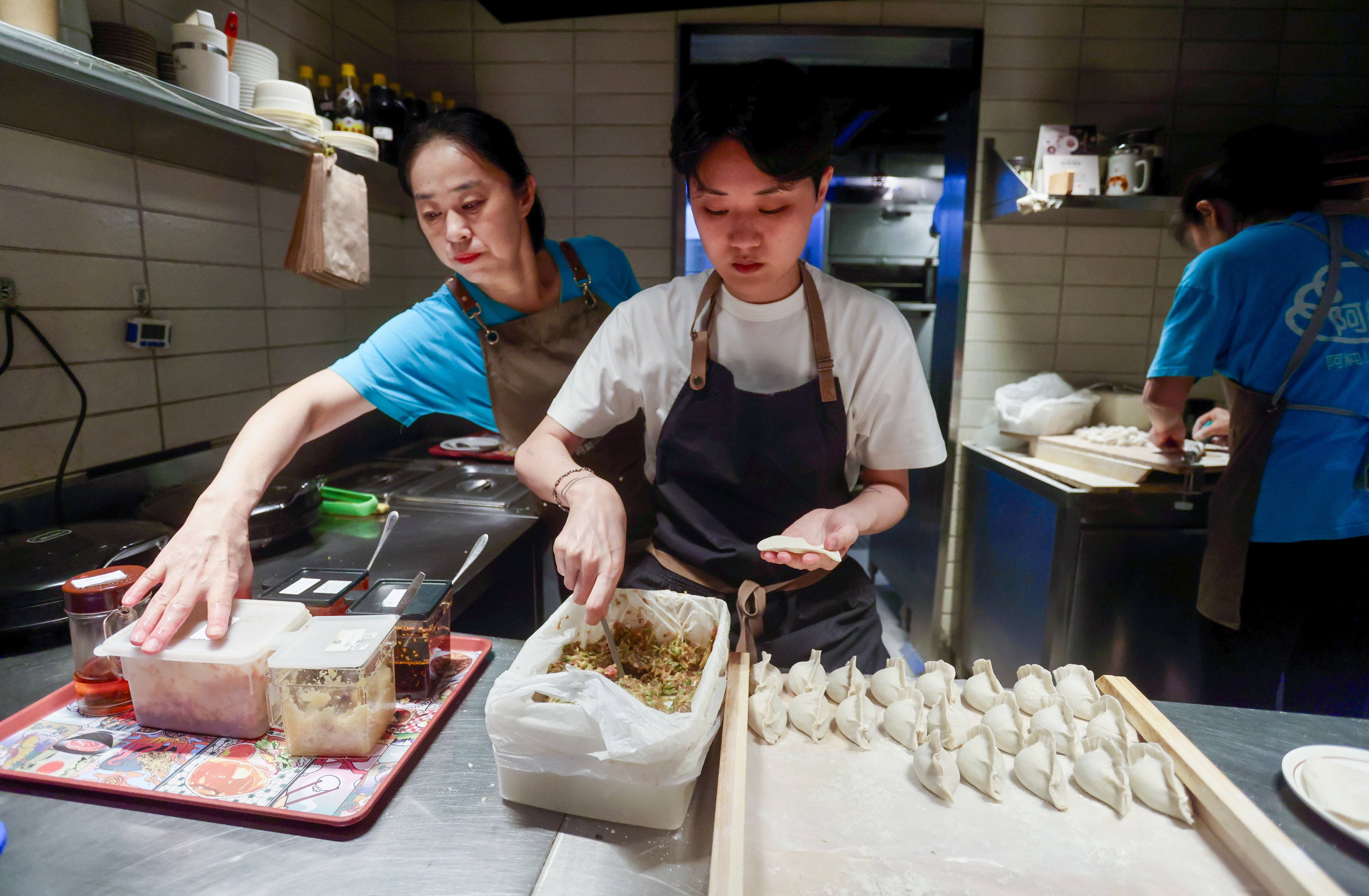 Mel Ng folds dumplings at Ah Chun Shandong Dumpling. Photo: Jonathan Wong