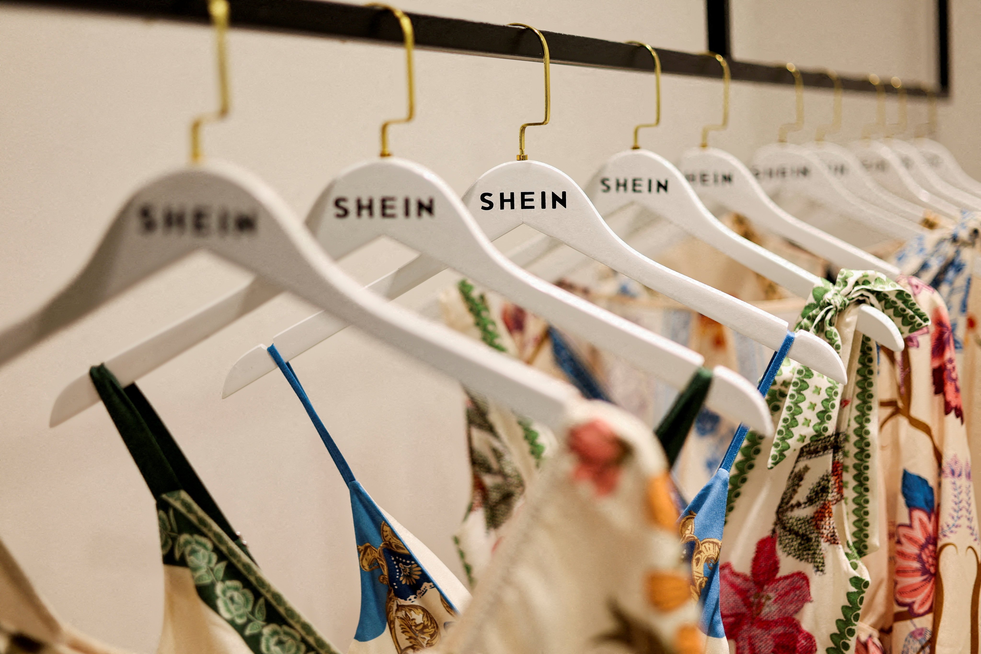 Clothes from fast-fashion brand Shein hang at their office in Sao Paulo, Brazil, on December 15, 2025. Photo: Reuters