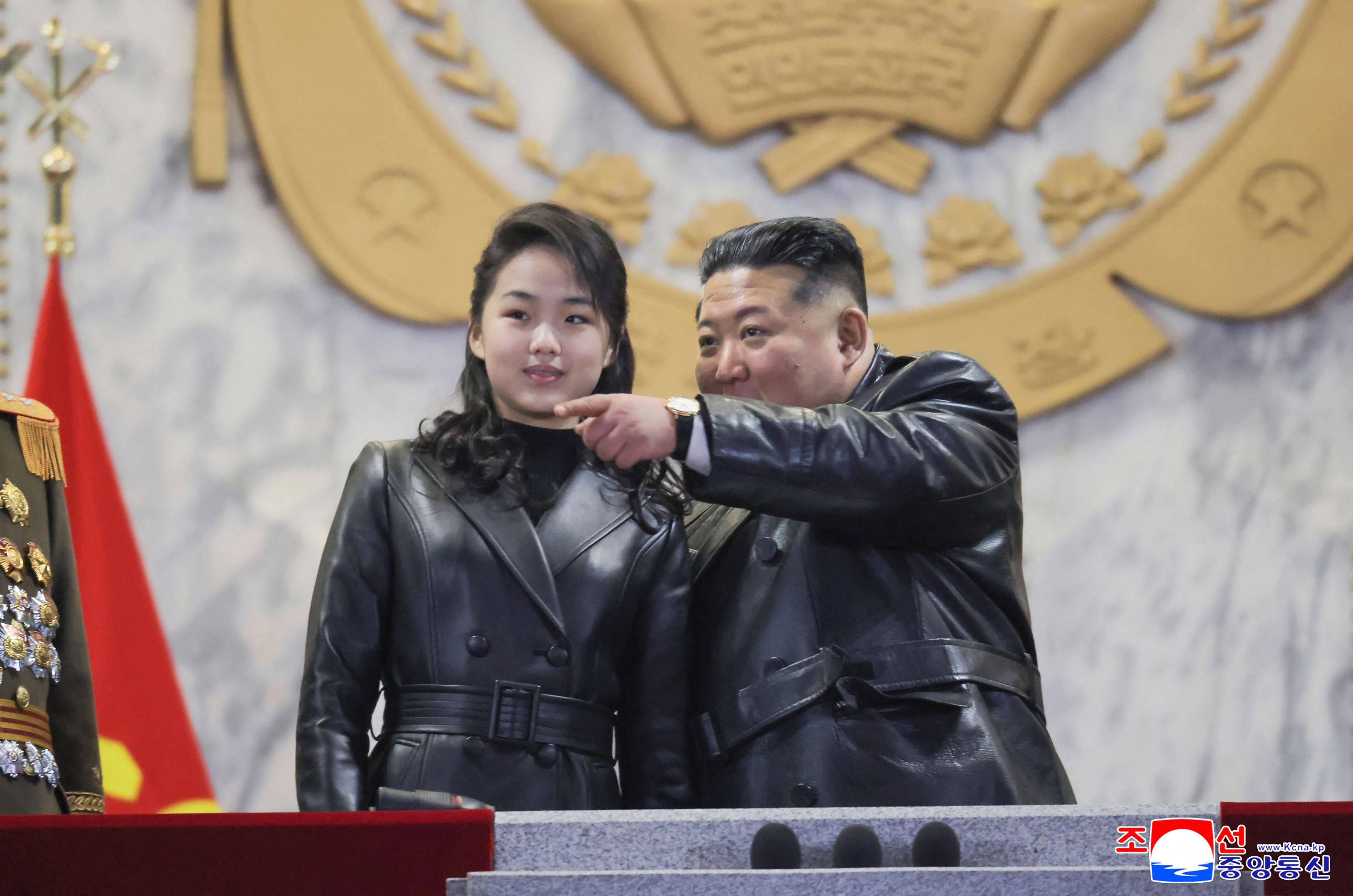 North Korean leader Kim Jong-un and his daughter Kim Ju-ae attend a military parade at Kim Il-sung Square in Pyongyang in February. Photo: KCNA via KNS / AFP