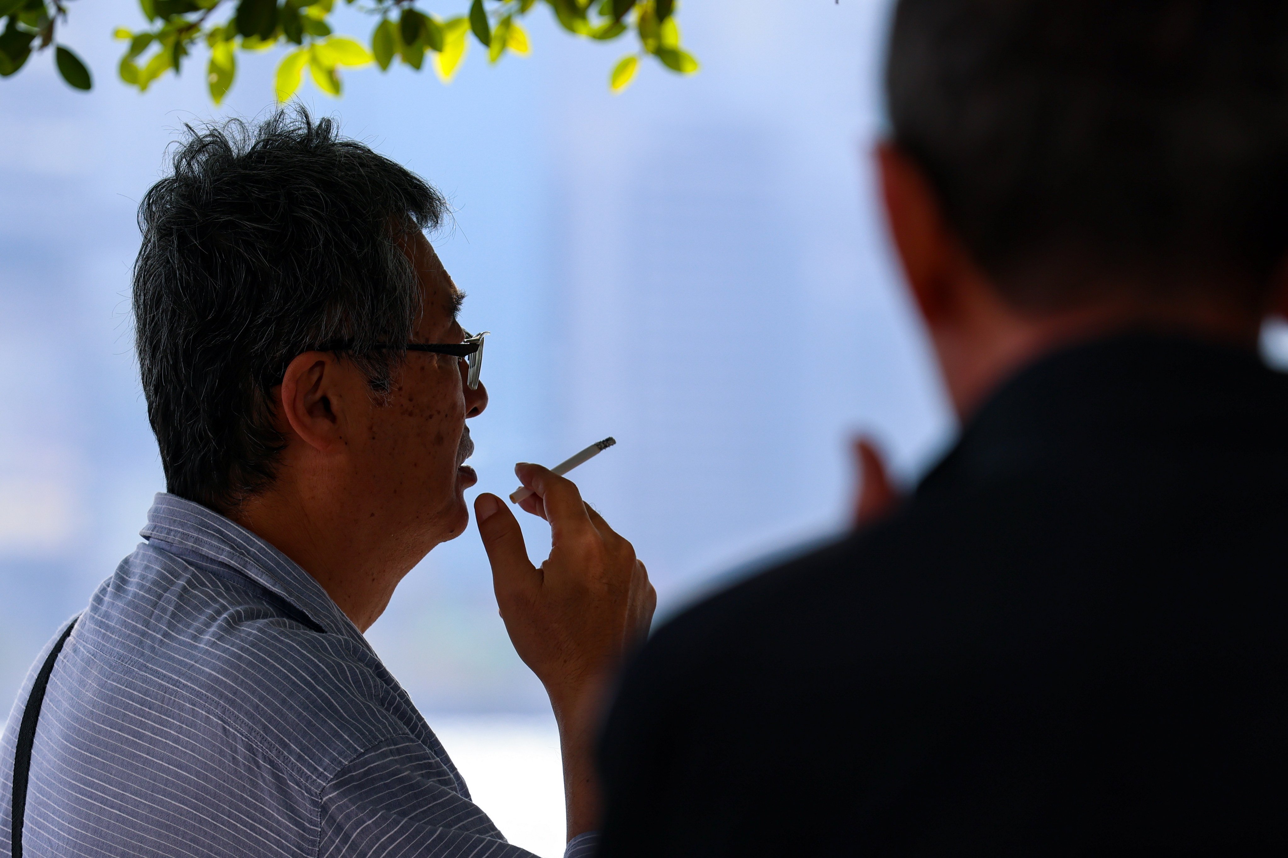 People smoking at Tsim Sha Tsui waterfront. Hong Kong has ramped up its anti-smoking measures this year, doubling the fixed penalty for smoking in no-smoking areas from HK$1,500 to HK$3,000 in January. Photo: Jelly Tse