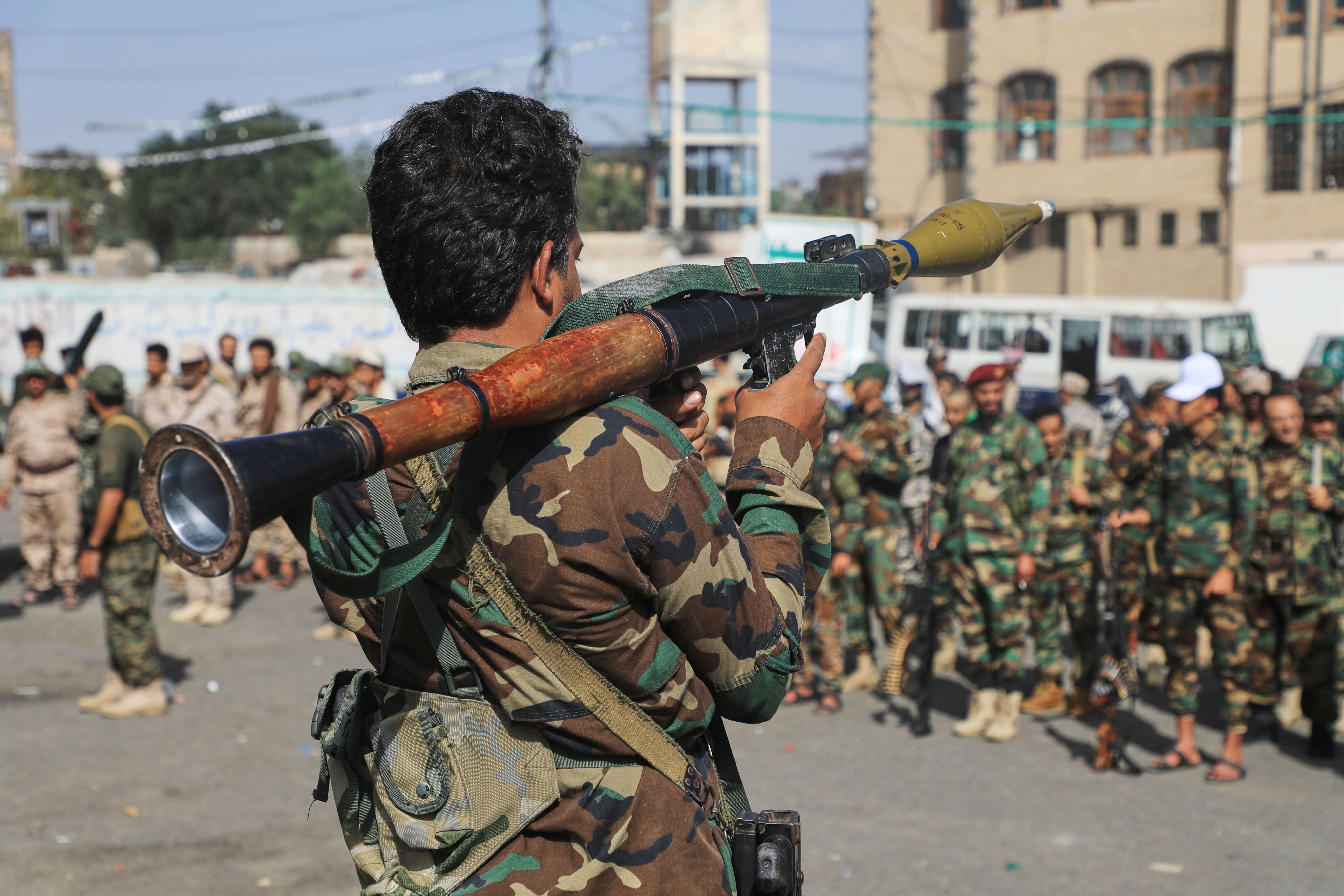A fighter with Yemen’s Houthi rebels carries a rocket-propelled grenade launcher as they march during a mobilisation campaign in Sanaa, Yemen, Thursday. Photo: AP