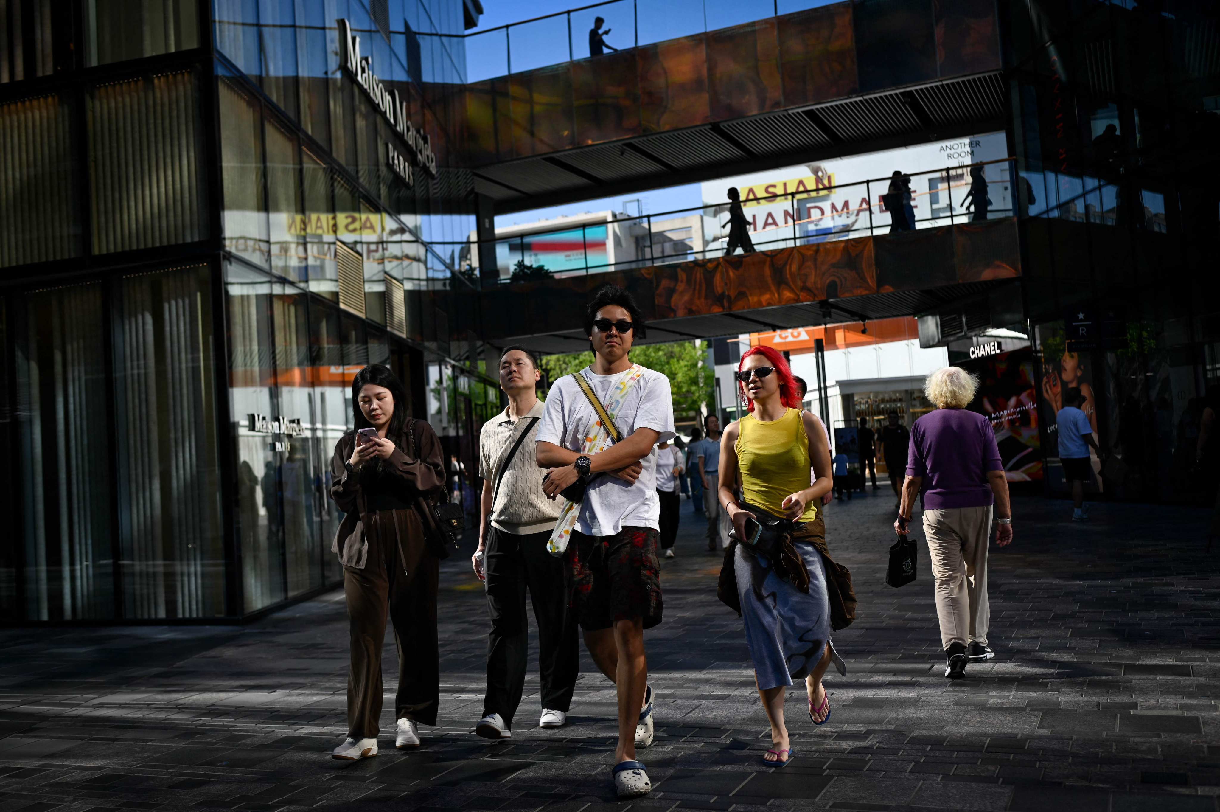 The widening yield spread between Chinese and American government bonds is unlikely to trigger capital flight from China. Photo: AFP