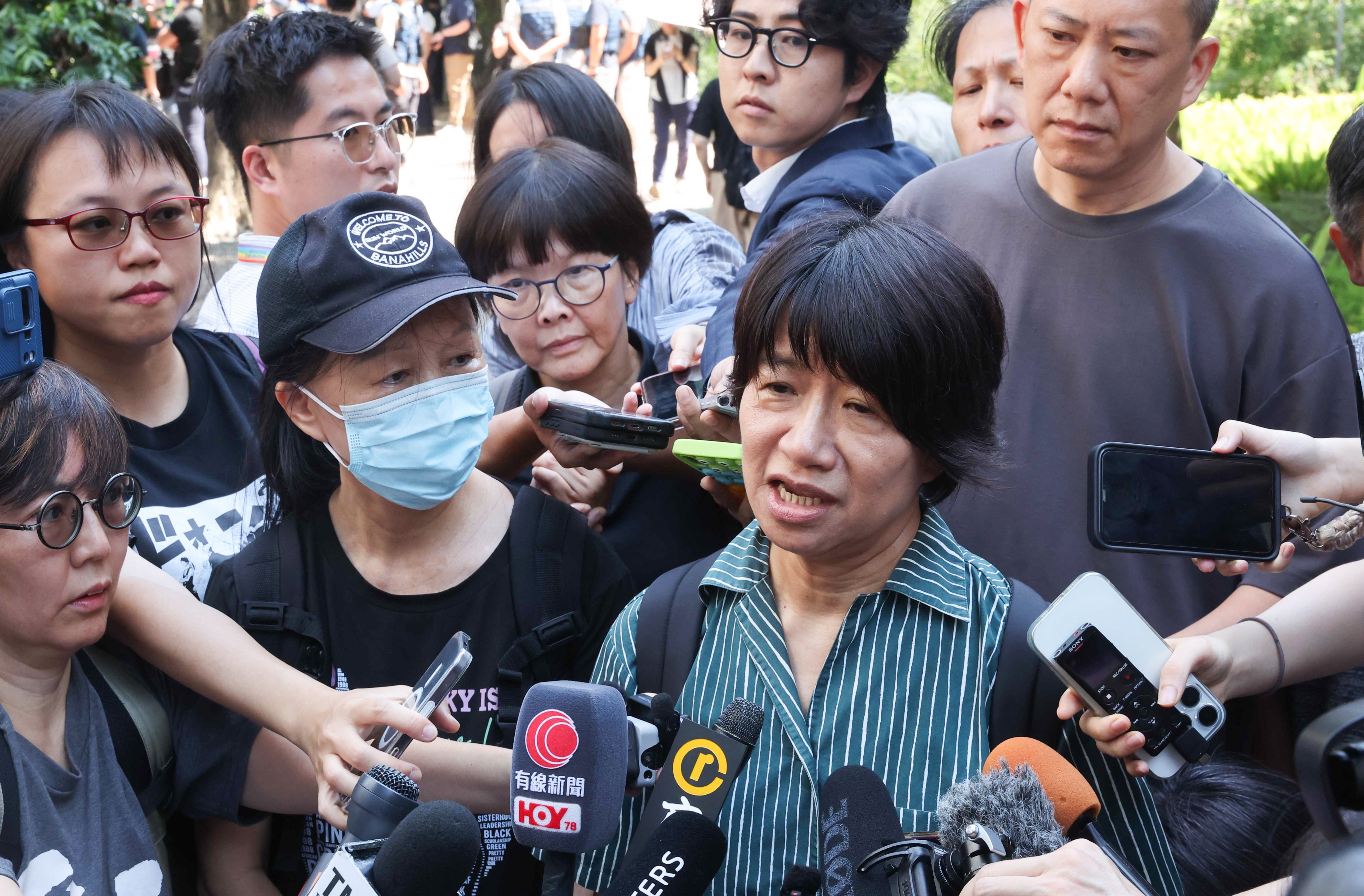 Medina Chow (left), the mother of former alliance vice-chairwoman Chow Hang-tung, and Elizabeth Tang (right), wife of former chairman Lee Cheuk-yan, speak to the media outside West Kowloon Court. Photo: Edmond So