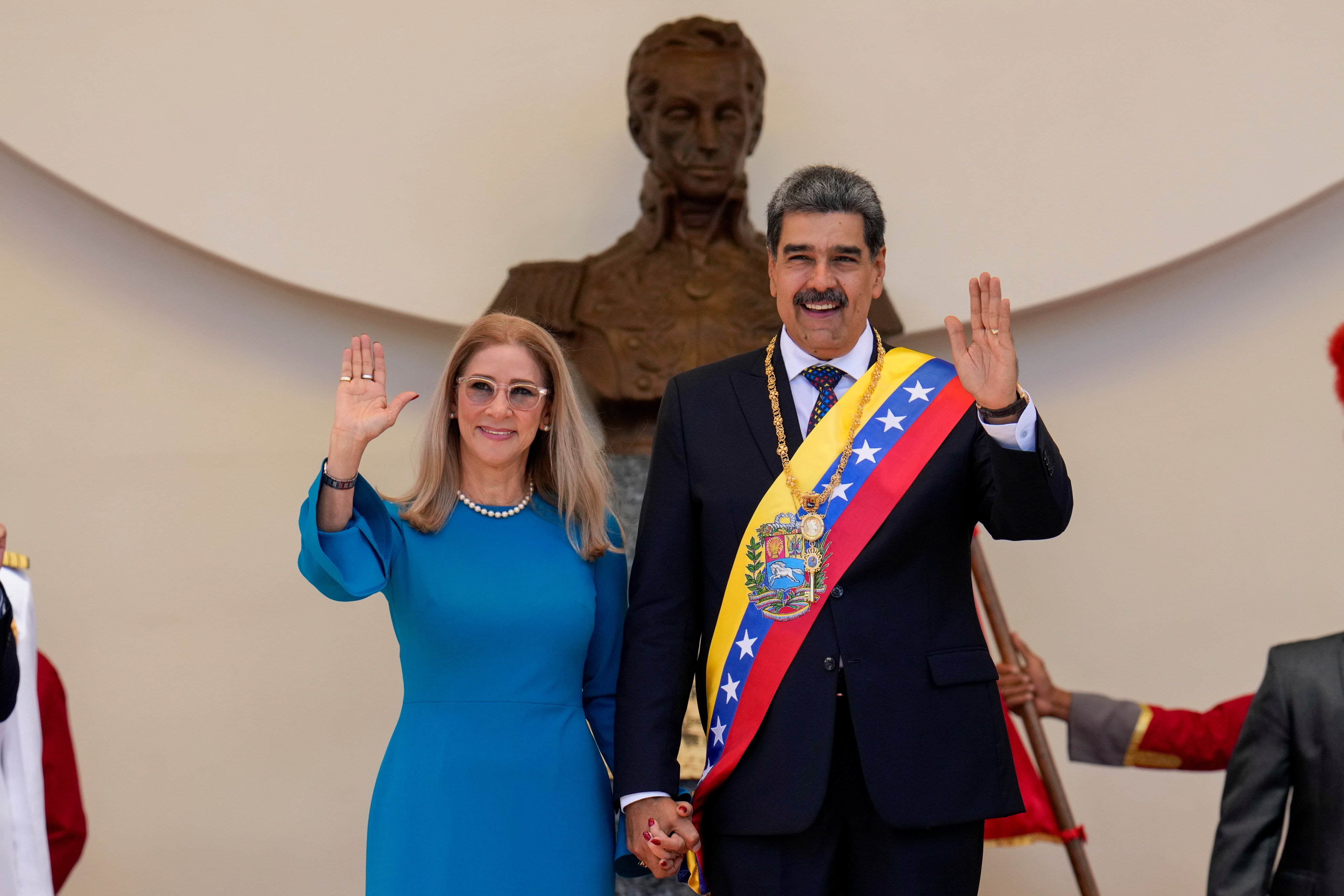 Venezuelan President Nicolas Maduro and his wife, Cilia Flores, wave after his swearing-in ceremony for a third term at the National Assembly in Caracas in January 2025. Photo: AP,