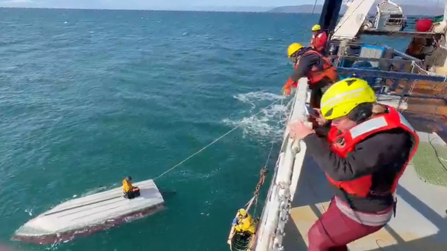 A teenager is rescued by a fishing vessel in the Bering Sea near St Lawrence Island, Alaska, on Monday. Photo: Carlos Alexis Escartin via AP