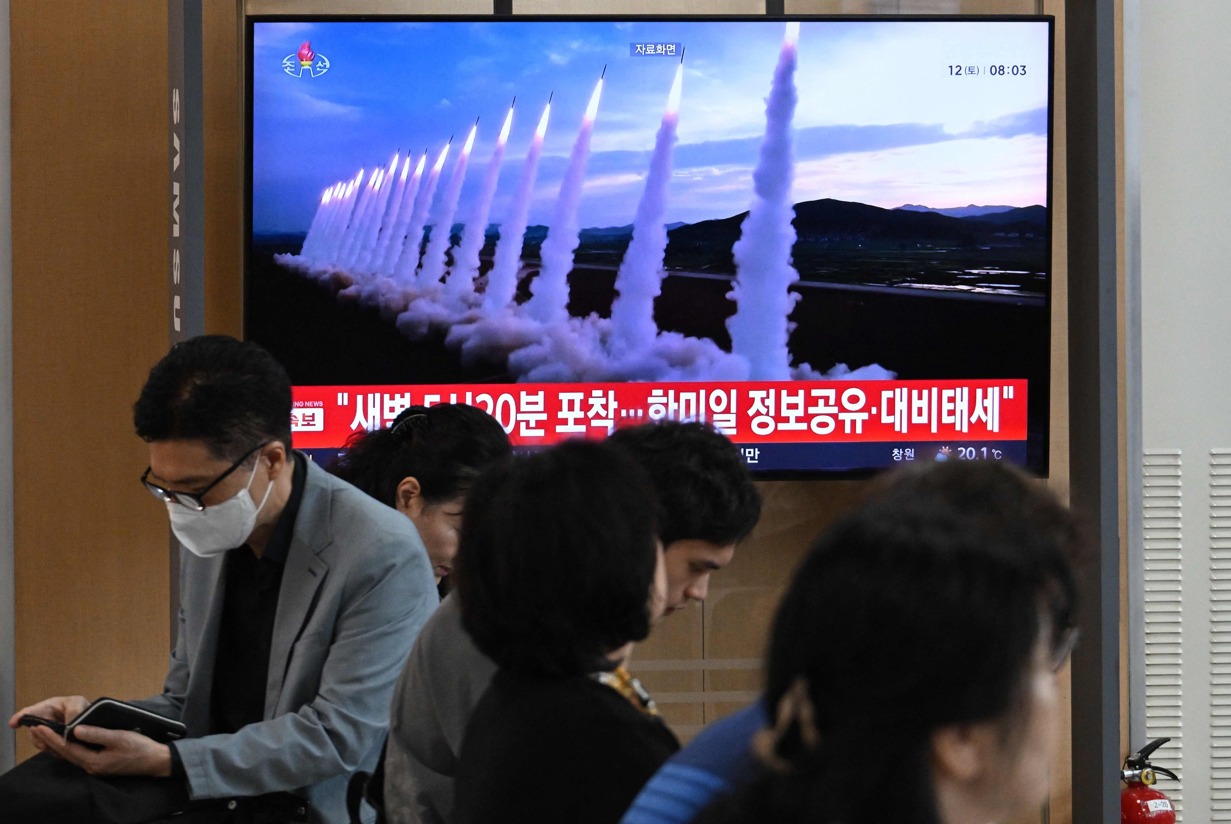A television screen shows a news broadcast with file footage of a North Korean missile test at a railway station in Seoul, South Korea, on Saturday morning. Photo: AFP
