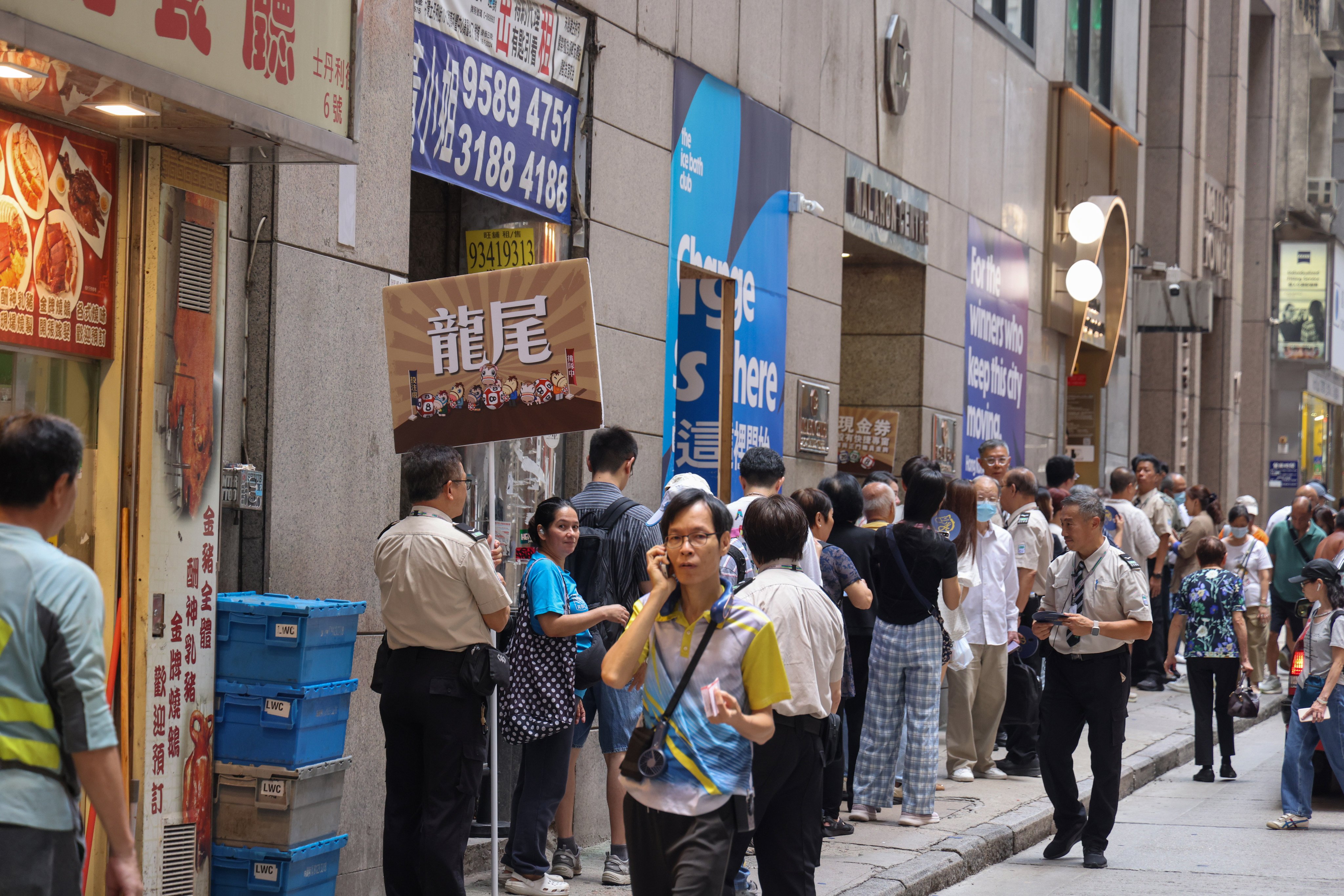 A queue outside the Hong Kong Jockey Club’s betting branch on Stanley Street in Central last Saturday. Nora Tam