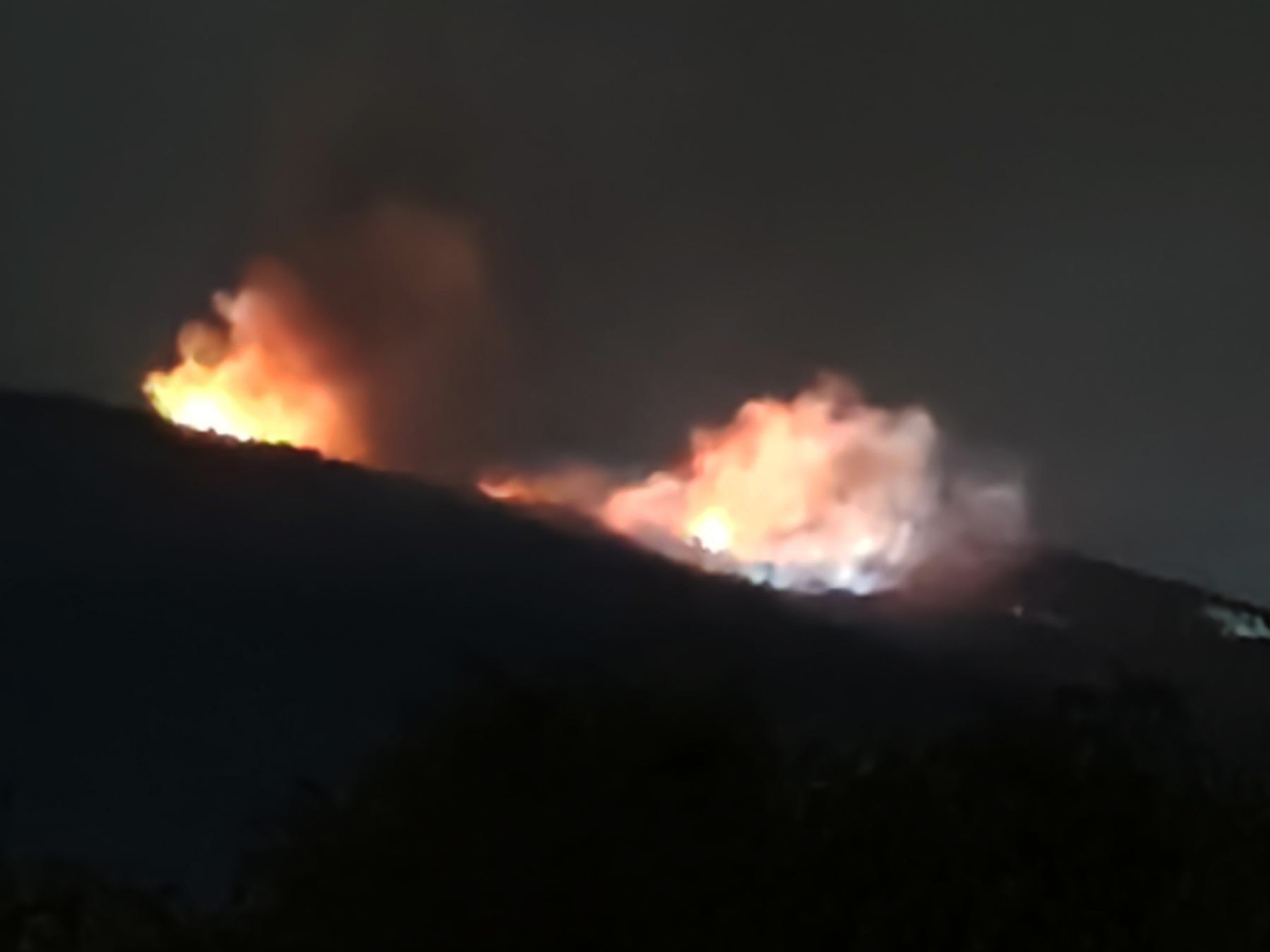 Fire from an ammunition depot storage of the EMCO company near Tsareva Livada, Bulgaria on Saturday. Photo: AP